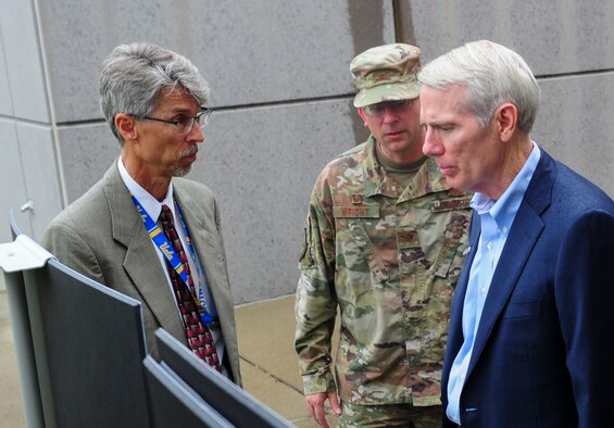 David Bek, Logistics and Facilities Directorate director, and Col. Parker H. Wright, National Air and Space Intelligence Center commander, present the NASIC facility expansion plan to Sen. Robert Portman, Aug 27. Bek explained the logistics of the expansion to include the layout, budget and construction timelines to Portman during the senator’s visit to Wright-Patterson Air Force Base. (U.S. Air Force photo by Senior Airman Michael Hunsaker)