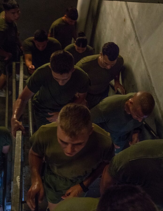 U.S. Marines with Marine Forces Reserve, run up a stairwell as part of a Total Force Fitness event at Marine Forces Support Facility New Orleans, Sept. 11, 2019. This was part of a MARFORRES Total Force Fitness event inspired by the 18th anniversary of 9/11 and the efforts of the first responders at the World Trade Center. The exercise consisted of Marines ascending and descending a five story stairwell 11 times, resulting in a total of 110 stories, which is equivalent to the height of the World Trade Center. (U.S. Marine Corps photo by Pfc. Leslie Alcaraz)