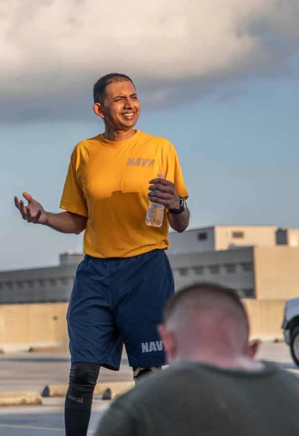U.S. Navy Lt. Rufus Mathews, a chaplain with Headquarters Battalion, Marine Forces Reserve, gives a speech after a Total Force Fitness event at Marine Corps Support Facility New Orleans, Sept. 11, 2019. During his speech, he spoke about unity through conflict. This was part of a MARFORRES Total Force Fitness event inspired by the 18th anniversary of 9/11 and the efforts of the first responders at the World Trade Center. The exercise consisted of Marines ascending and descending a five story stairwell 11 times, resulting in a total of 110 stories, which is equivalent to the height of the World Trade Center. (U.S. Marine Corps photo by Pfc. Leslie Alcaraz)