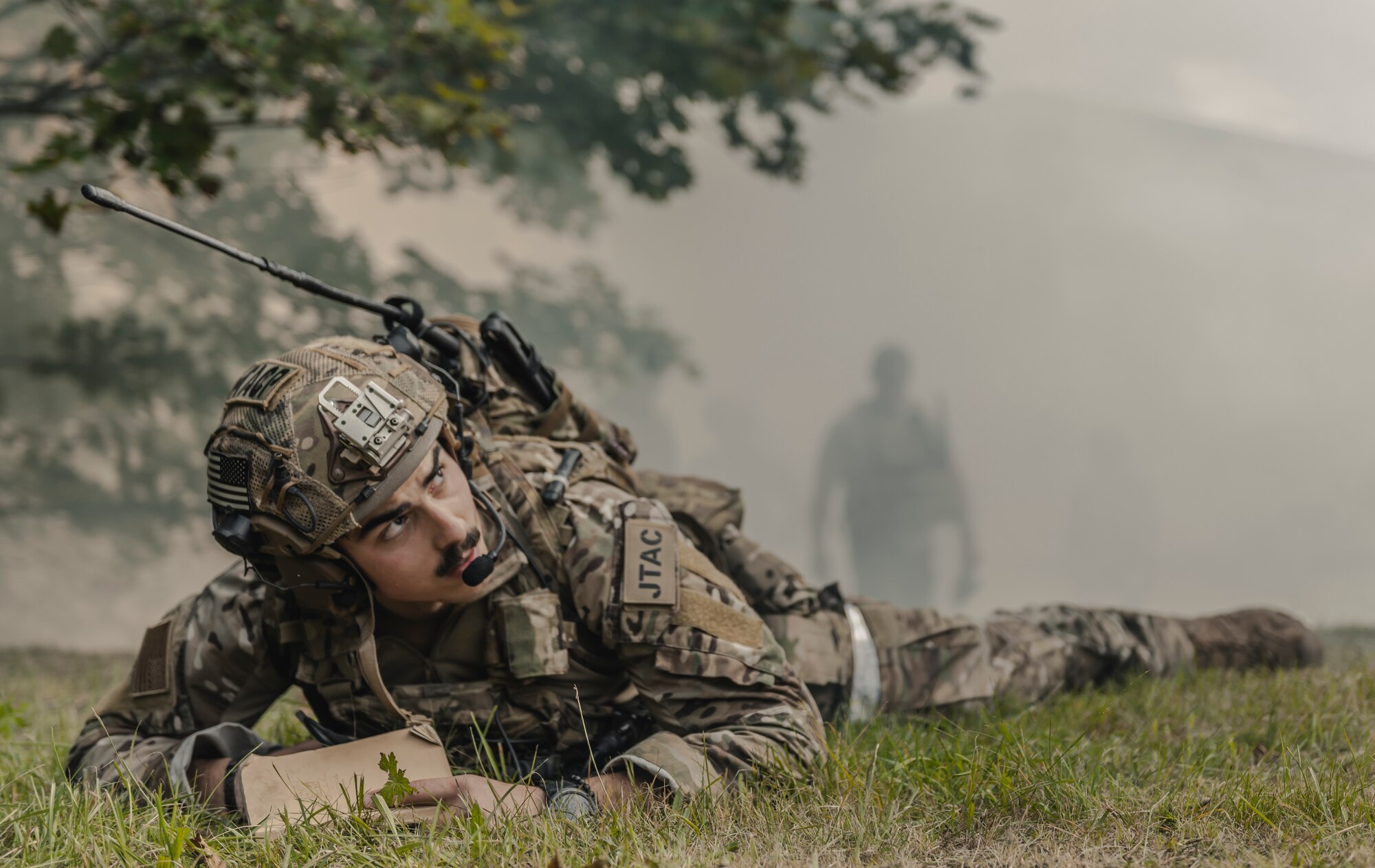 U.S. Air Force Senior Airman Brandan Brown, 2nd Expeditionary Air Support Operations Squadron battalion Tactical Air Control Party, watches close air support provide exercise fire during exercise Ample Strike 2019.