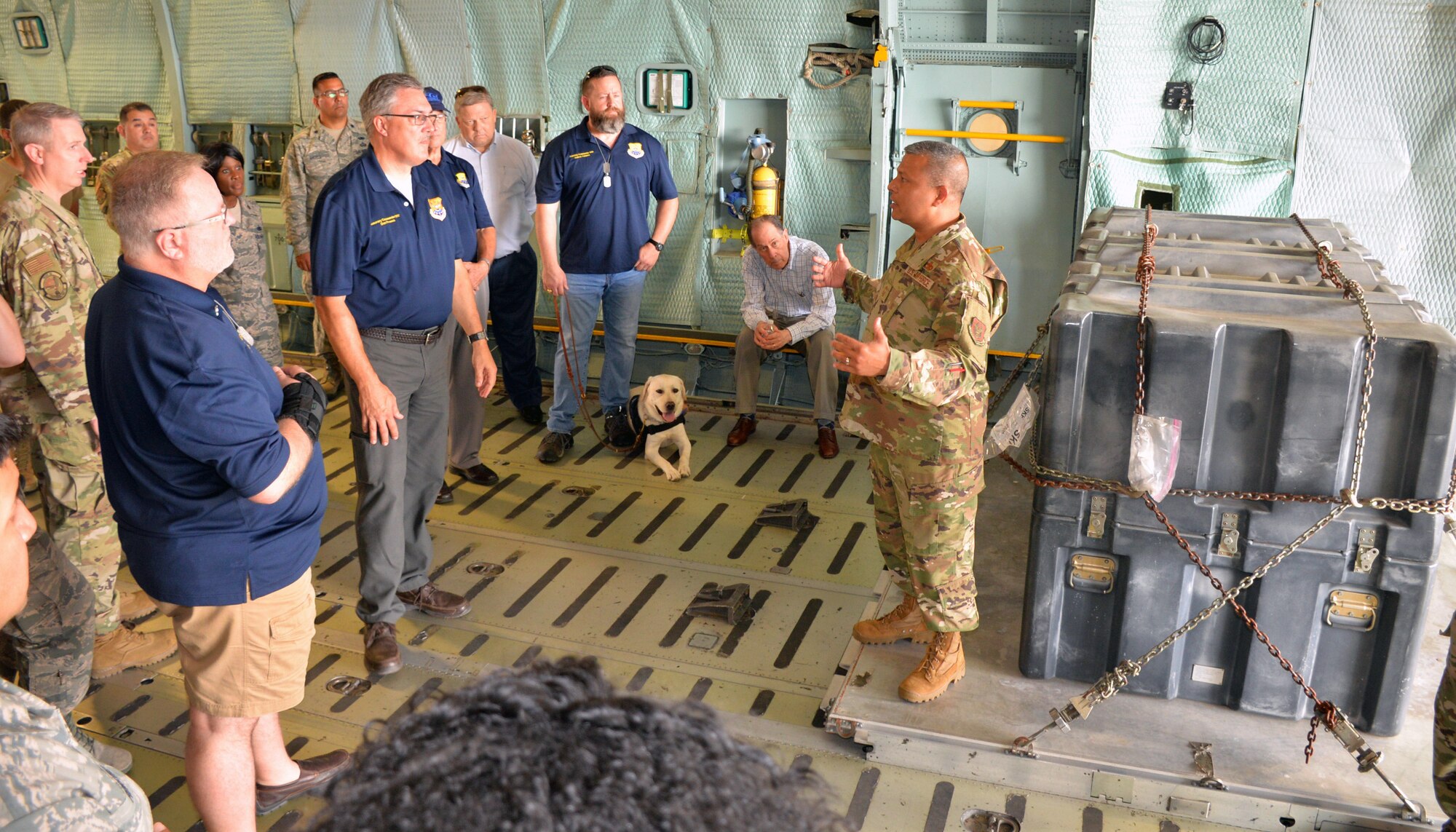 Chief Master Sgt. Vishal M. Rose, 74th Aerial Port Squadron superintendent of operations, talks to the honorary commanders about how the military airlift system moves cargo and passengers during the 433rd Mission Support Group at Joint Base San Antonio-Lackland, Texas Sept. 7, 2019.
