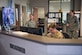 U.S. Air Force Airmen from the 1st Operational Support Squadron Weather Flight, brief each other in preparation for upcoming hurricanes at Joint Base Langley-Eustis, Virginia, Aug. 21, 2019.