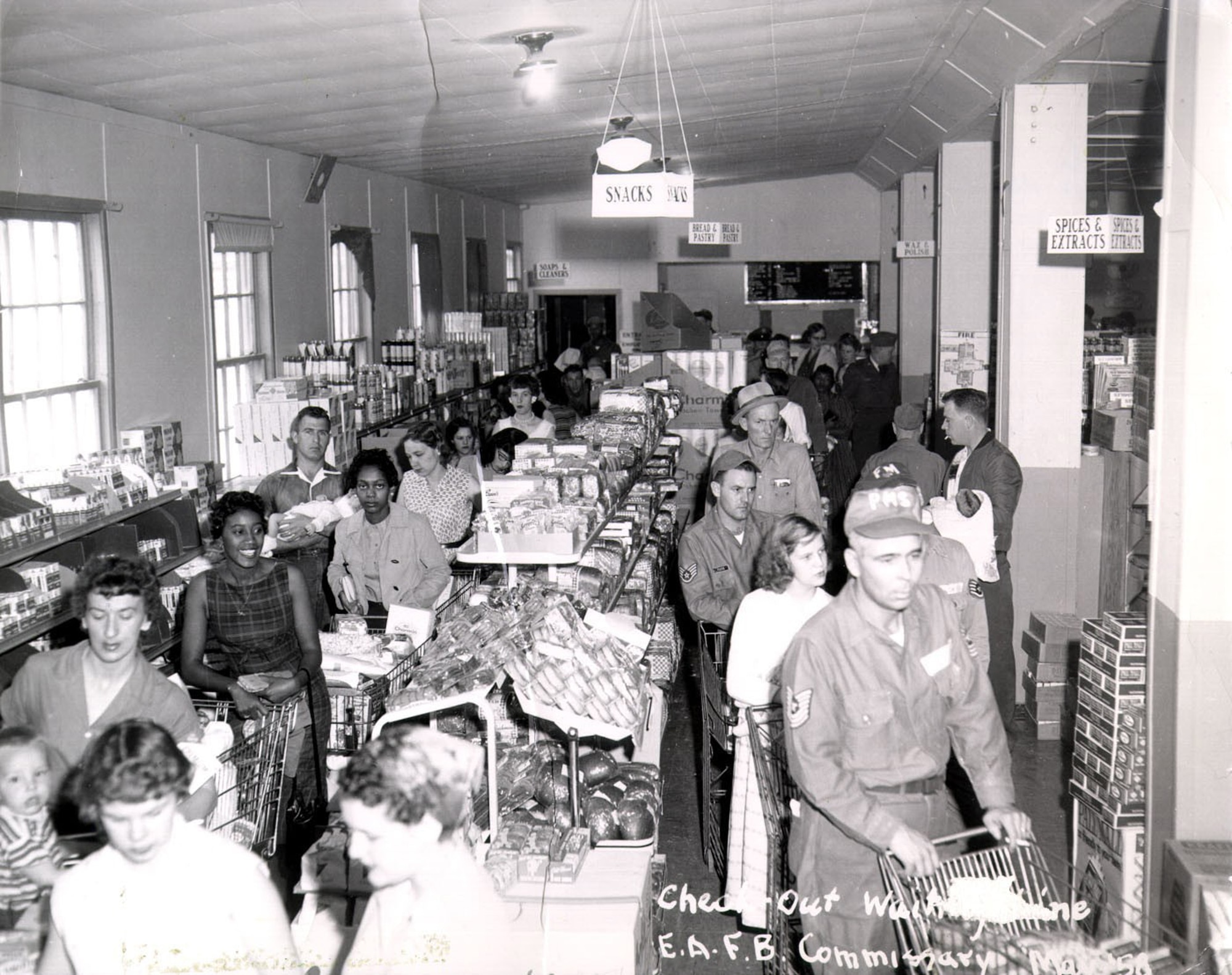 Patrons line up to check out their groceries at Ellsworth Air Force Base, South Dakota, in 1958. (Courtesy photo)