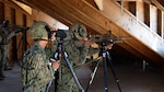 A sniper team from the 25th Infantry Regiment aims to fire while the sniper team from the 2-130th Infantry Regiment fires alongside them during Rising Thunder 2019.