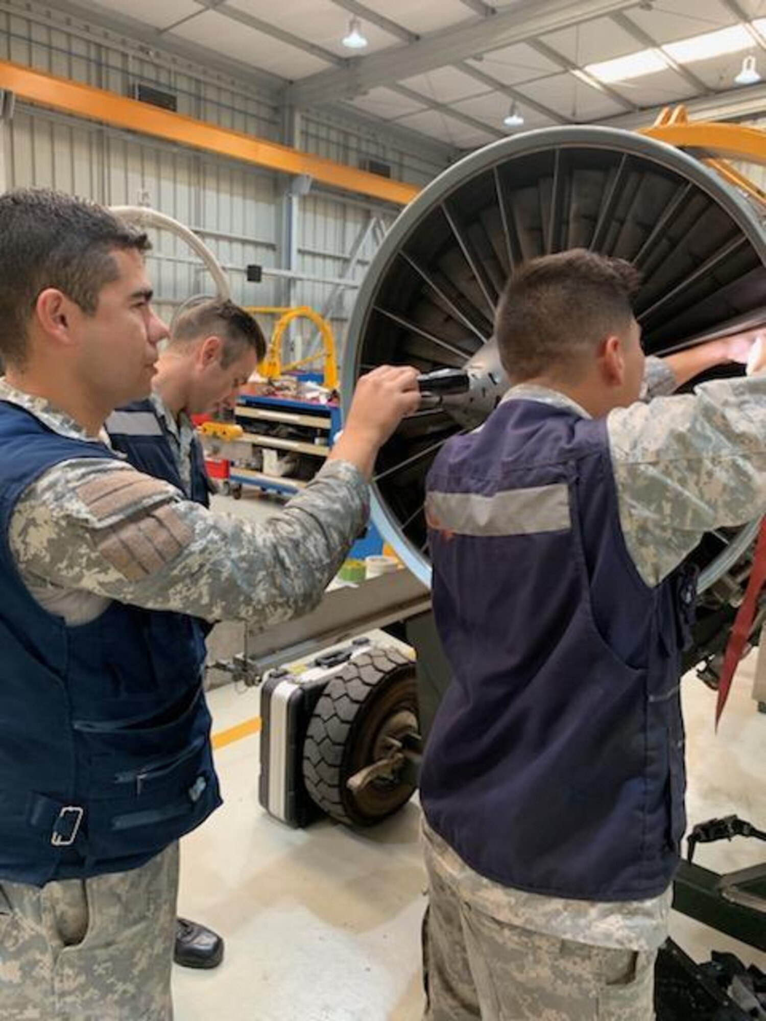 Chilean airmen practice performing blade blending August 26, 2019, at Cerro Moreno Air Base, Chile. U.S. Airmen were on a temporary  duty where they ceritified 15 Chilean airmen on how to perform repairs on F100-Pratt and Whitney-W220 jet engine fan blades. (Courtsey photo)