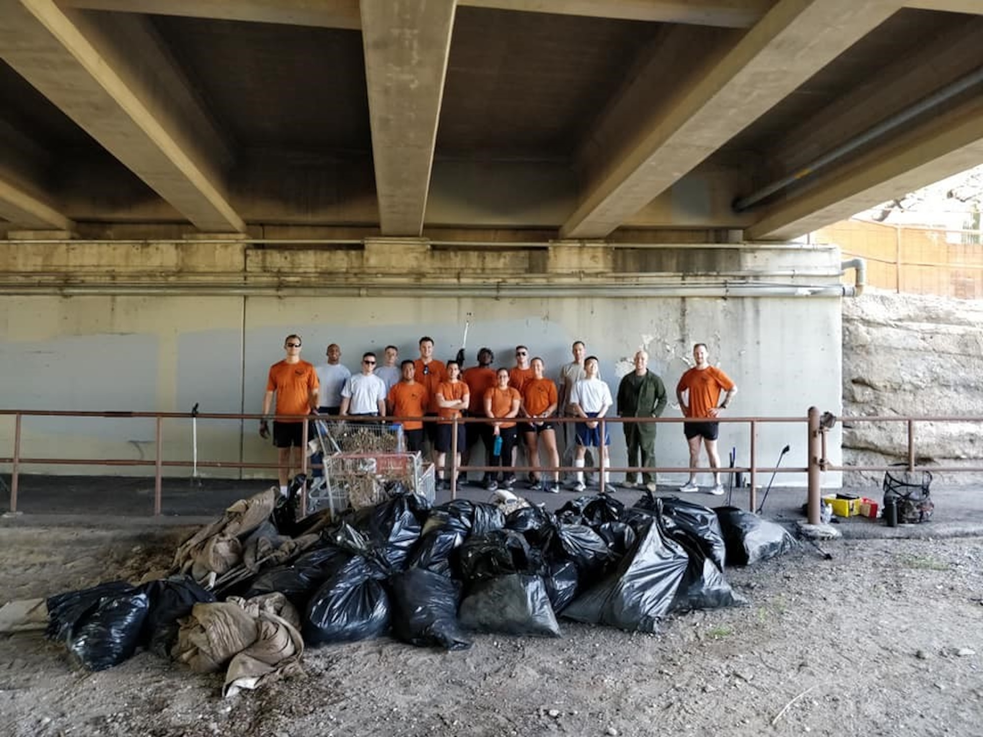 a group photo of airmen performing community service