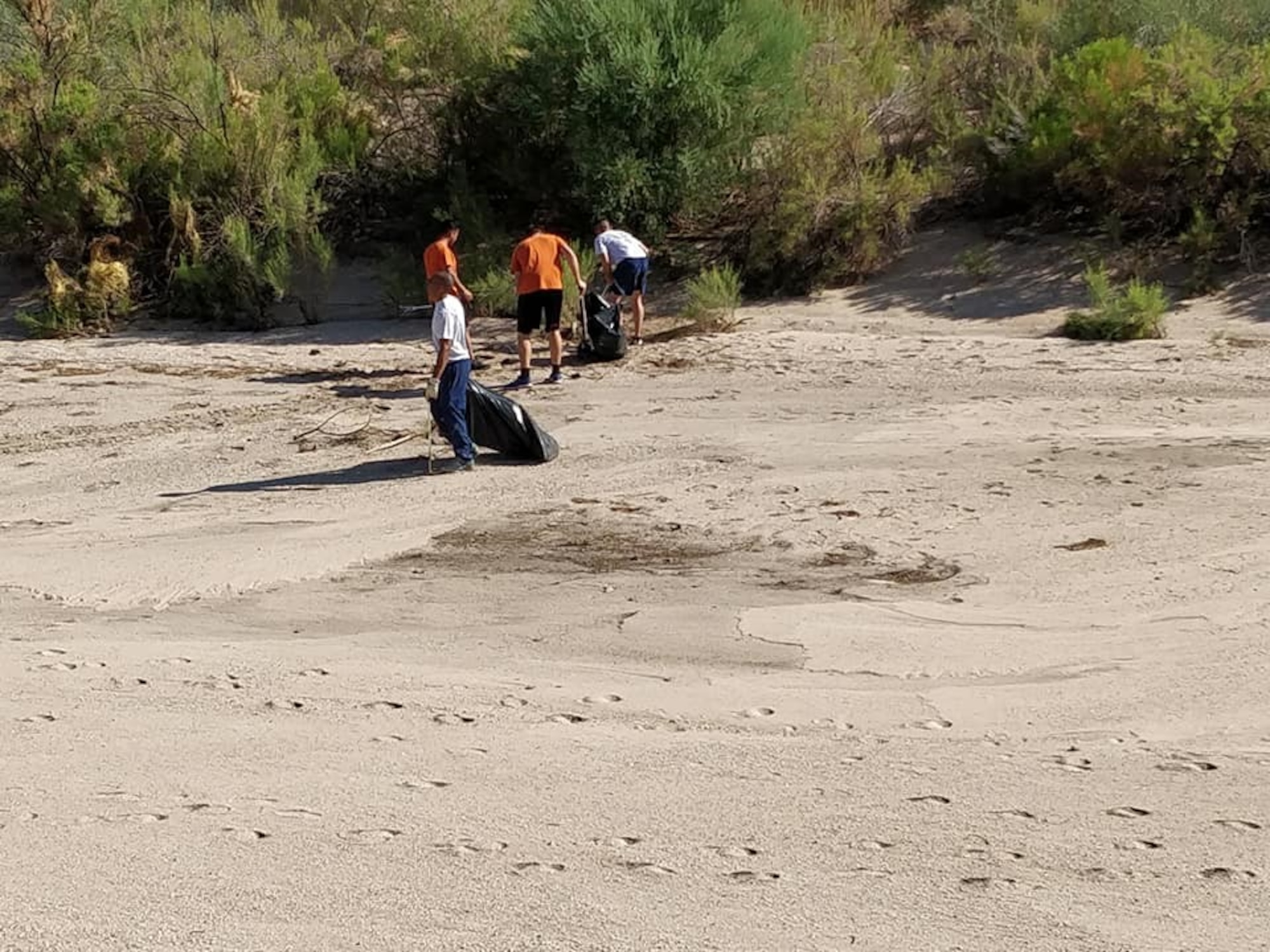 a photo of airmen performing community service