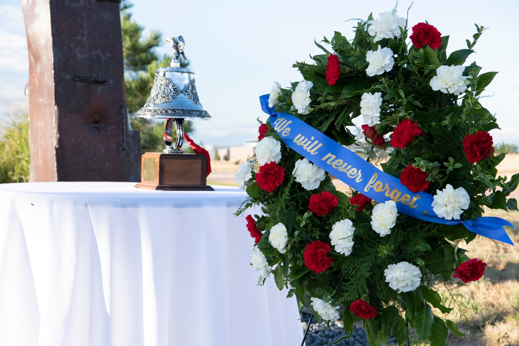 Schriever Air Force Base hosted a wreath laying ceremony in remembrance of those affected by the attacks on Sept. 11, 2001.The striking of the bell honors fallen first responders who lost their lives during the attack. (U.S. Air Force photo by Airman 1st Class Jonathan Whitely)