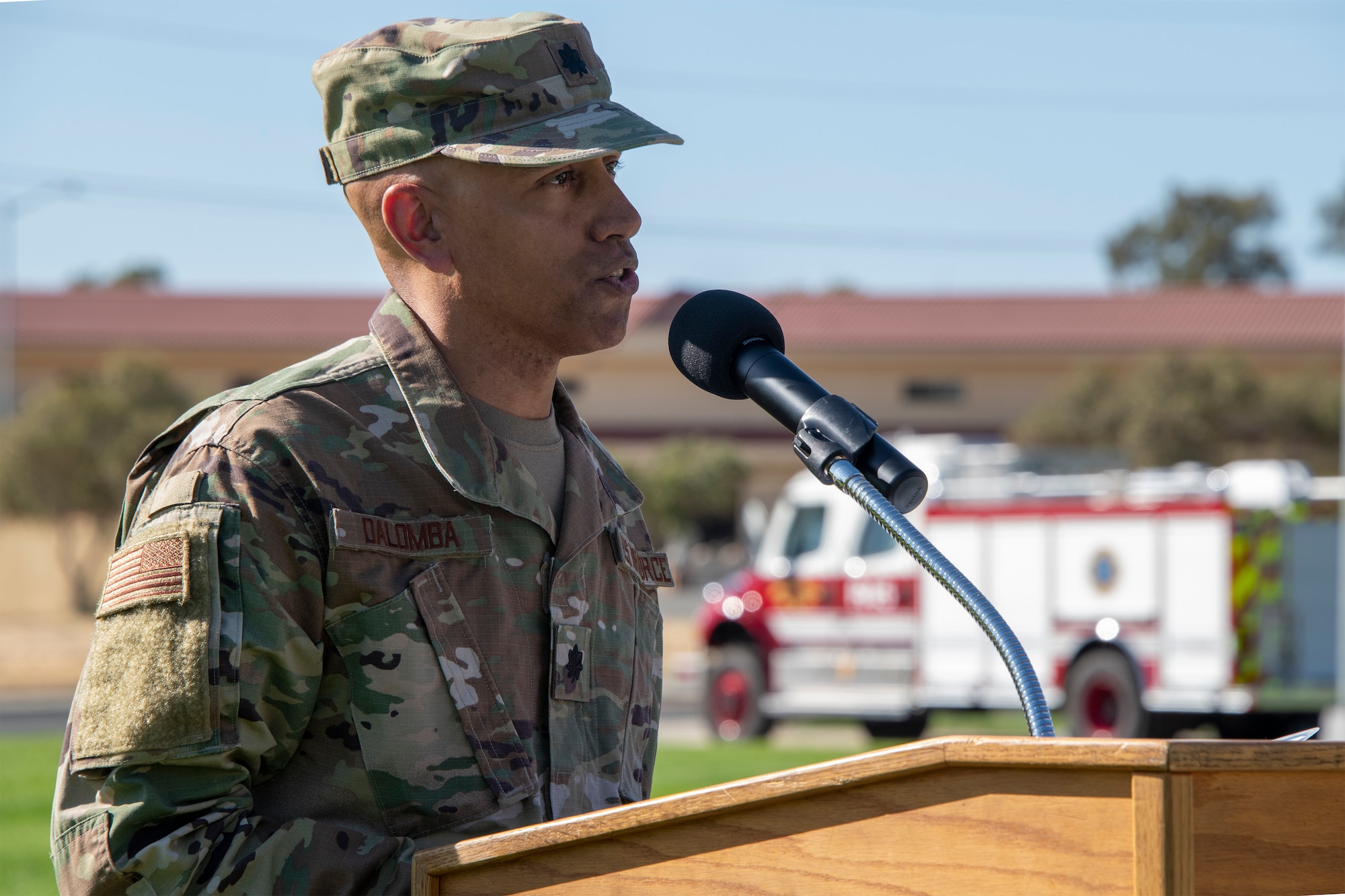U.S. Air Force Lt. Col. John Dalomba, 60th Medical Operations Squadron flight commander, delivers remarks during a 9/11 Memorial Retreat Ceremony Sept. 11, 2019, at Travis Air Force Base, California. The ceremony honored the victims of the terrorist attacks on Sept. 11, 2001 and the first responders who risked their lives to save them. (U.S. Air Force photo by Heide Couch)