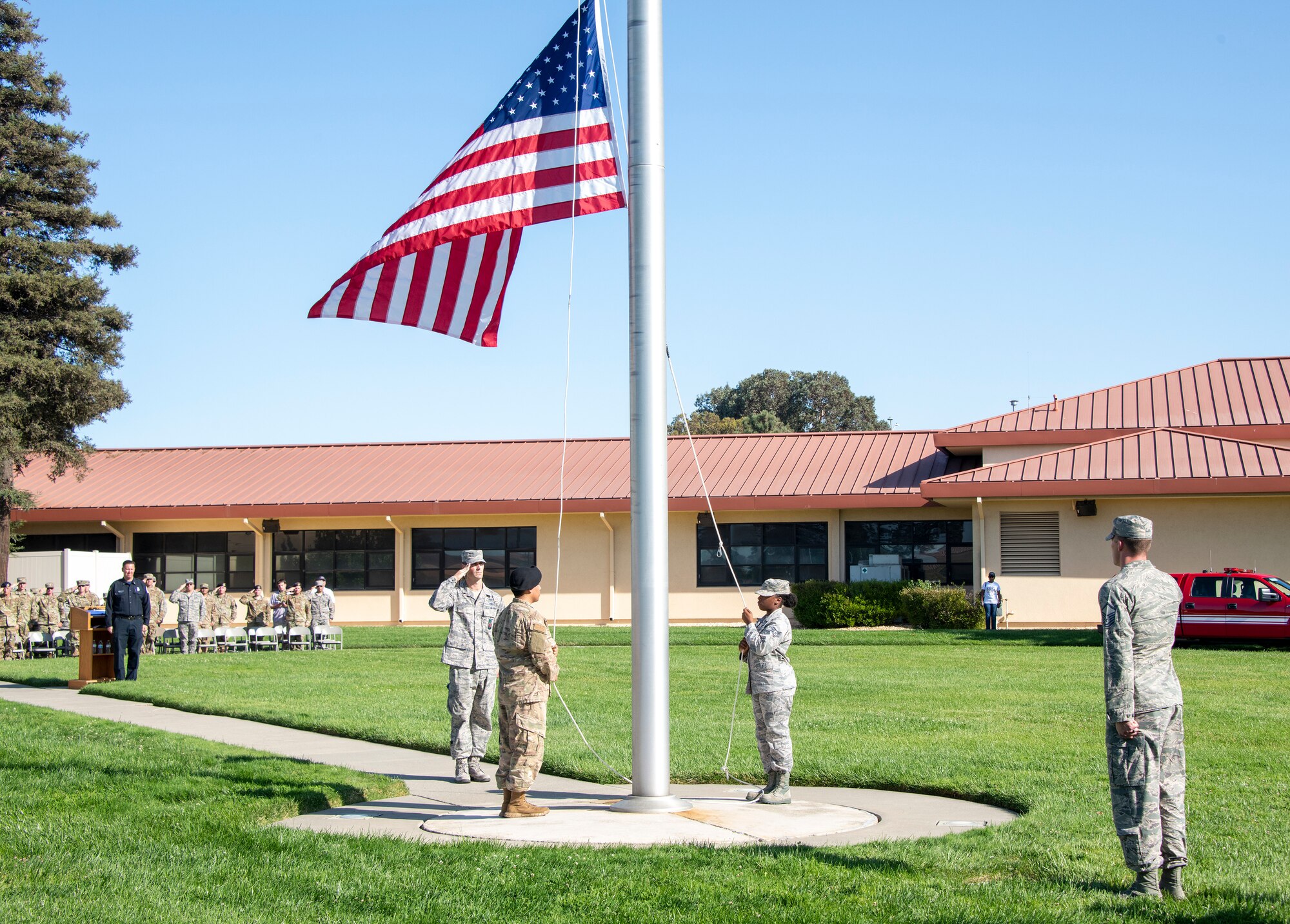 U.S. Air Force first responders from 60th Security Forces Squadron and the 60th Civil Engineer Squadron retire the colors during a 9/11 Memorial Retreat Ceremony Sept. 11, 2019, at Travis Air Force Base, California. The ceremony honored the victims of the terrorist attacks on Sept. 11, 2001 and the first responders who risked their lives to save them. (U.S. Air Force photo by Heide Couch)