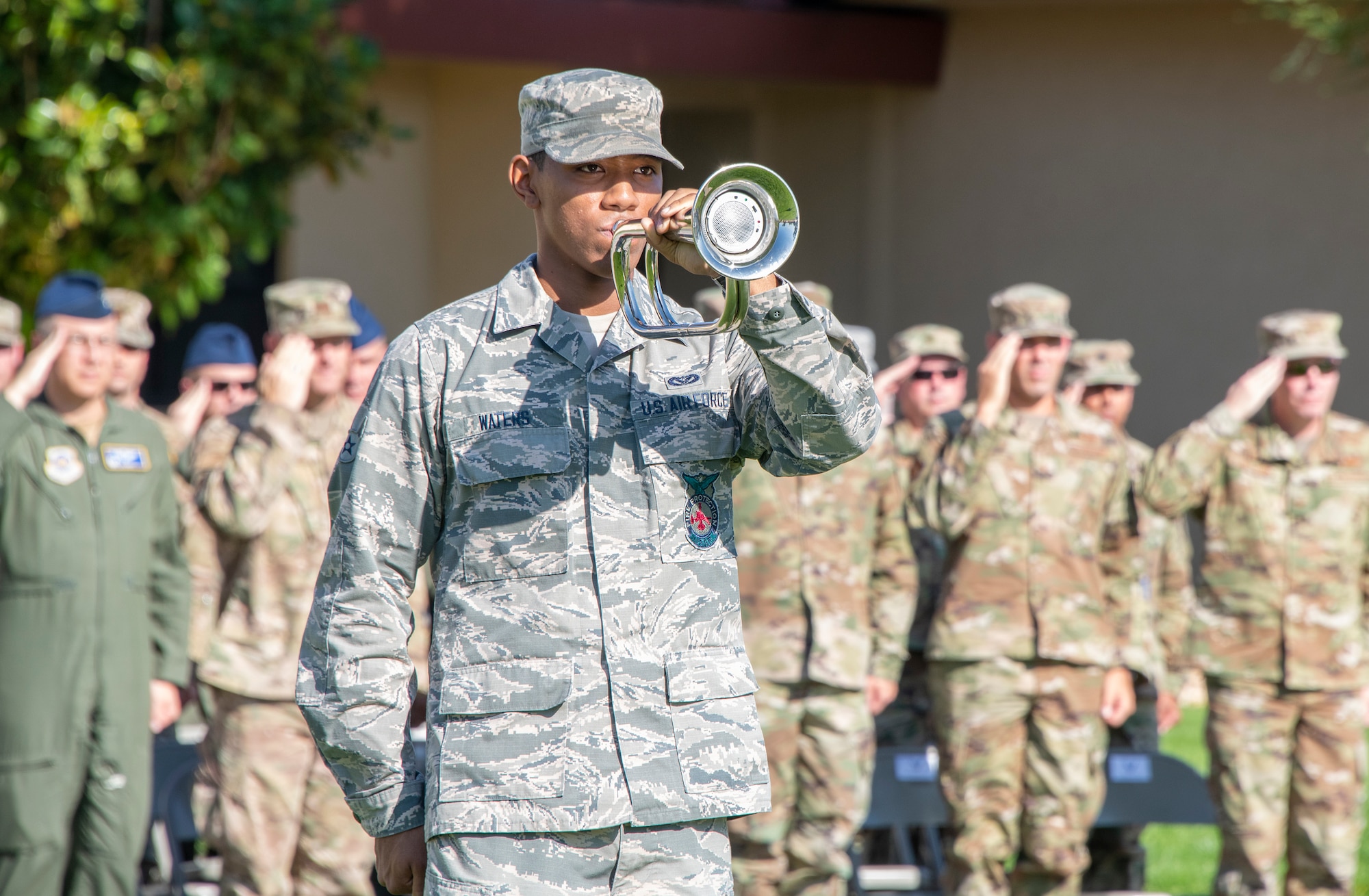 U.S. Air Force Airman 1st Class Trevon Waters, 60th Civil Engineer Squadron firefighter, performs during a rendering of Taps at a 9/11 Memorial Retreat Ceremony Sept. 11, 2019, at Travis Air Force Base, California. The ceremony honored the victims of the terrorist attacks on Sept. 11, 2001 and the first responders who risked their lives to save them. (U.S. Air Force photo by Heide Couch)