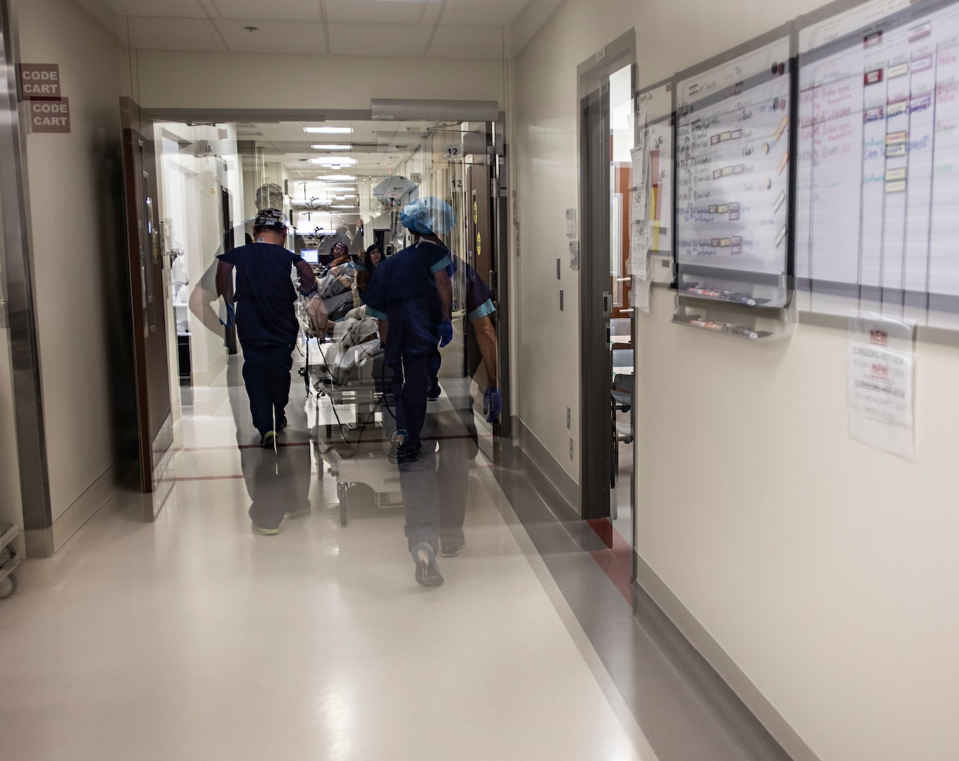 Retired U.S. Army Capt. Katie Blanchard is wheeled out of an operating room after surgery Sept. 6 at Wilford Hall Ambulatory Surgical Center, Joint Base San Antonio-Lackland. The surgery is a painful one with a long recovery time, but greatly improves a burn patient's range of motion, pain and appearance.