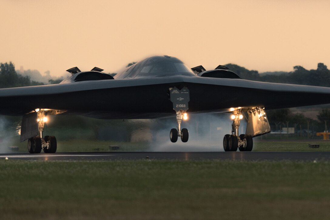 A military plane touches the ground during takeoff and landing training.