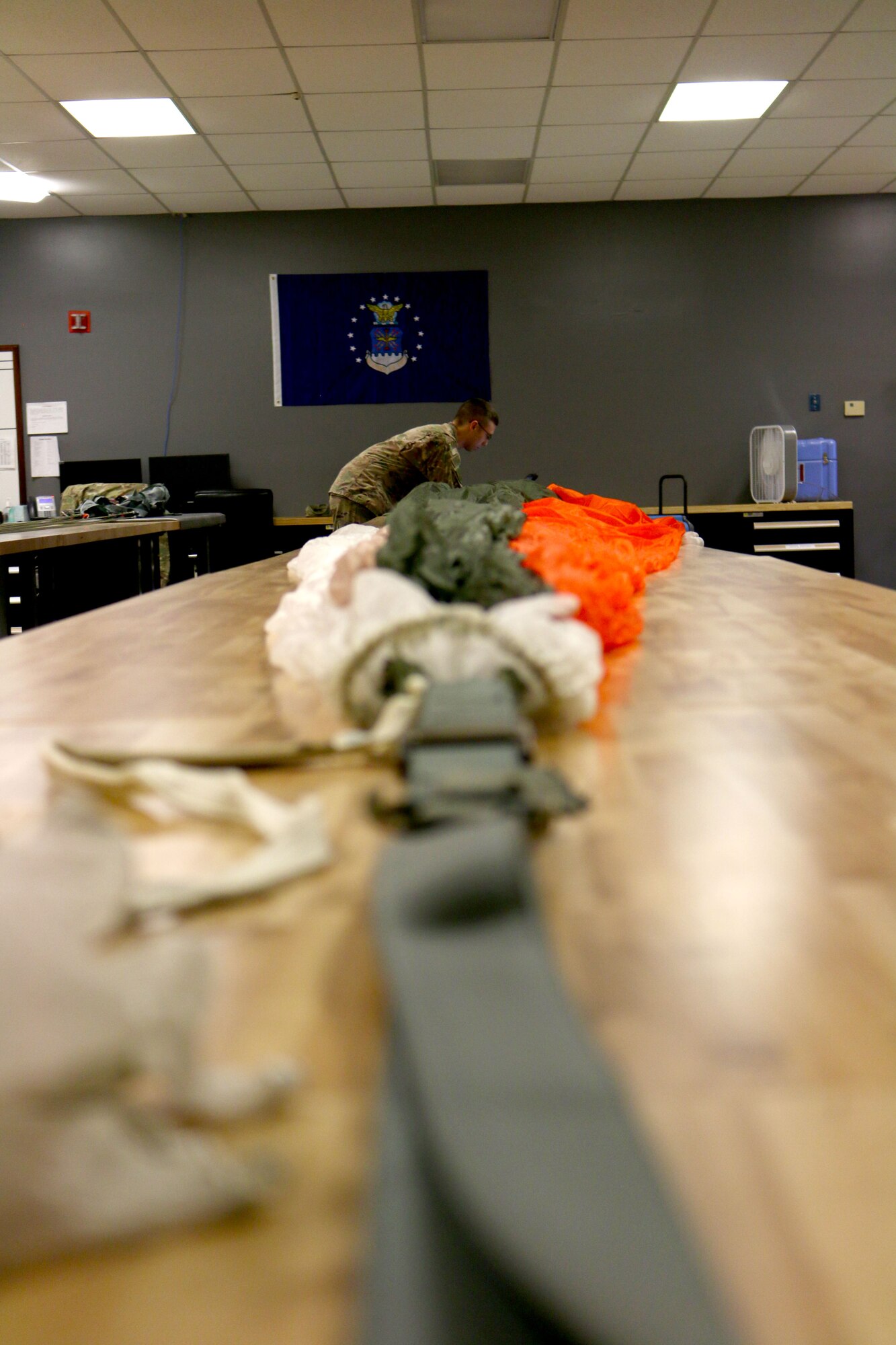 Senior Airman David Smith, 445th Operations Support Squadron, aircrew flight equipment shop, prepares to check and repack a BA-22 parachute. The BA-22s have to be repacked once a year. The process takes approximately one hour per parachute. (U.S. Air Force photo/Staff Sgt. Joel McCullough)