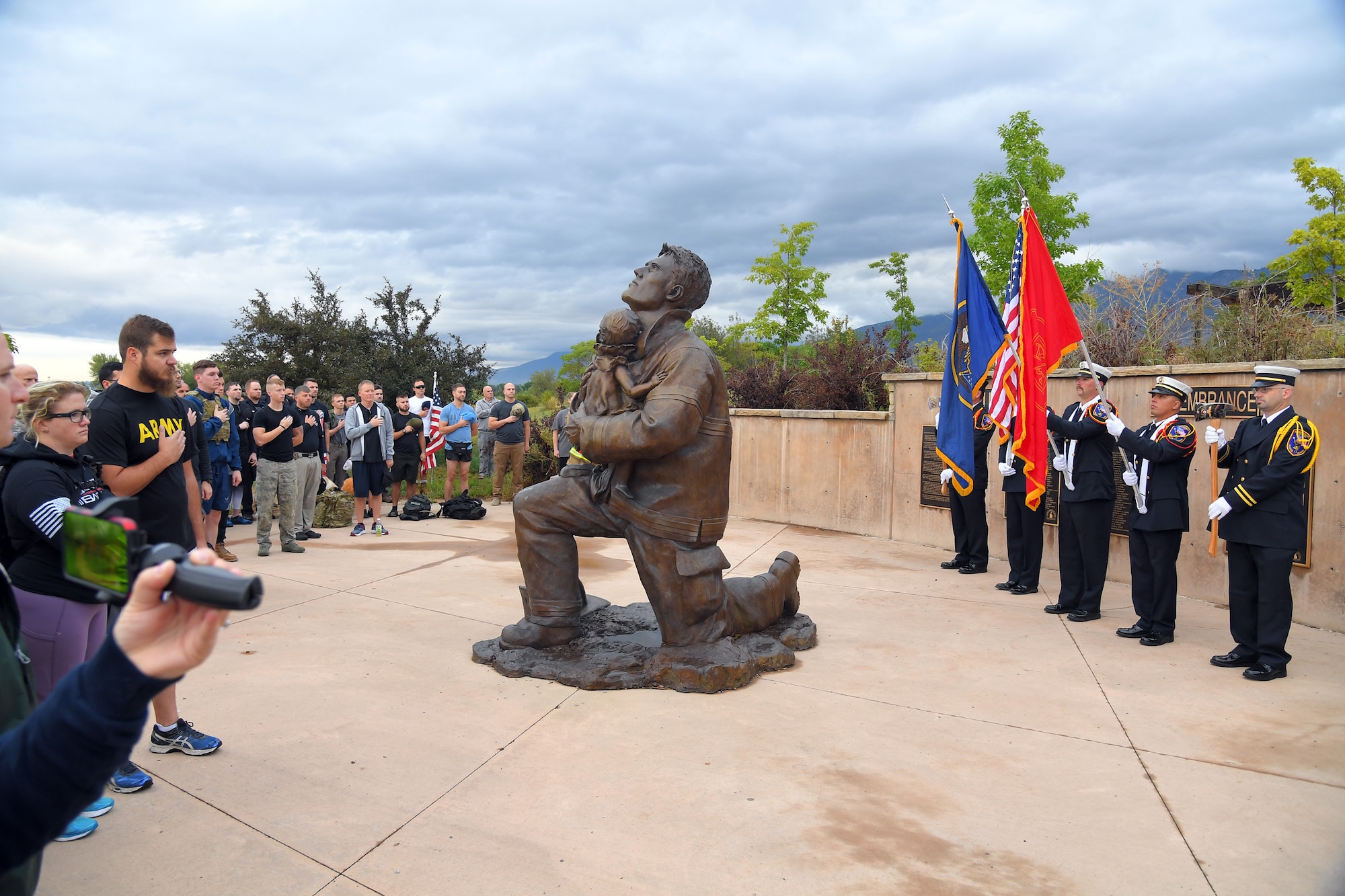 Participants salute the colors during the opening ceremony for the 9/11 Memorial Ruck March, at the Utah State University Botanical Gardens in Kaysville, Utah, Sept. 11, 2019. The event was co-sponsored by Hill Air Force Base first responders and fire and police departments from Kaysville and Layton, to honor and remember the fallen from the events of Sept. 11, 2001. (U.S. Air Force photo by Todd Cromar)