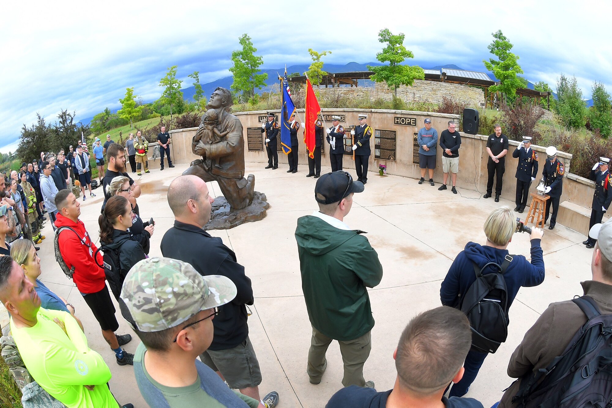 Participants listen to the ringing of the bell, during the opening ceremony of the 9/11 Memorial Ruck March, at the Utah State University Botanical Gardens in Kaysville, Utah, Sept. 11, 2019. The event was co-sponsored by Hill Air Force Base first responders and fire and police departments from Kaysville and Layton, to honor and remember the fallen from the events of Sept. 11, 2001. (U.S. Air Force photo by Todd Cromar)