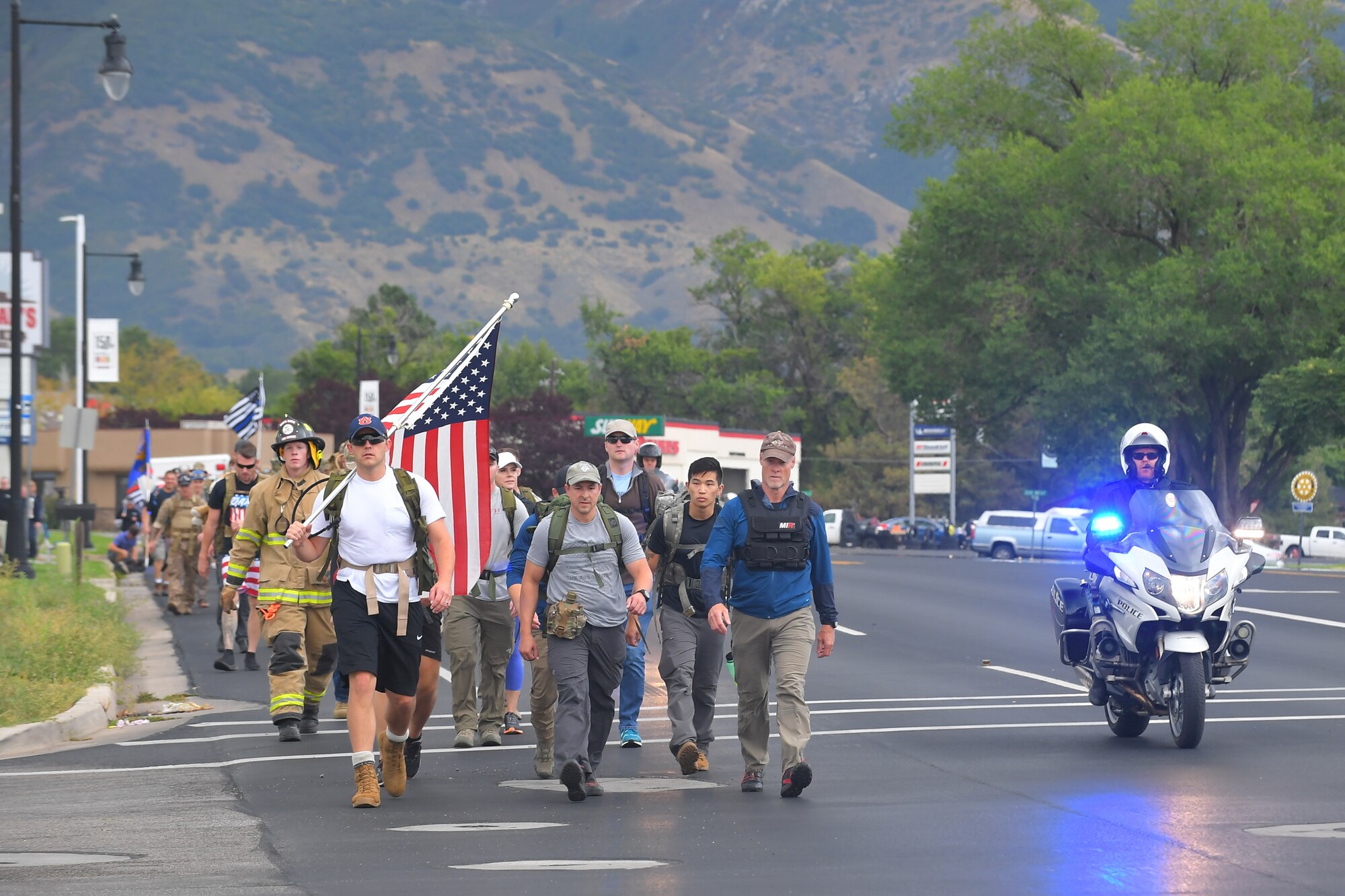Participants walked 9.11 miles, some with 30-pound packs or firefighter gear during 9/11 Memorial Ruck March, in Kaysville, Utah, Sept. 11, 2019. The event was co-sponsored by Hill Air Force Base first responders and fire and police departments from Kaysville and Layton, to honor and remember the fallen from the events of Sept. 11, 2001. (U.S. Air Force photo by Todd Cromar)
