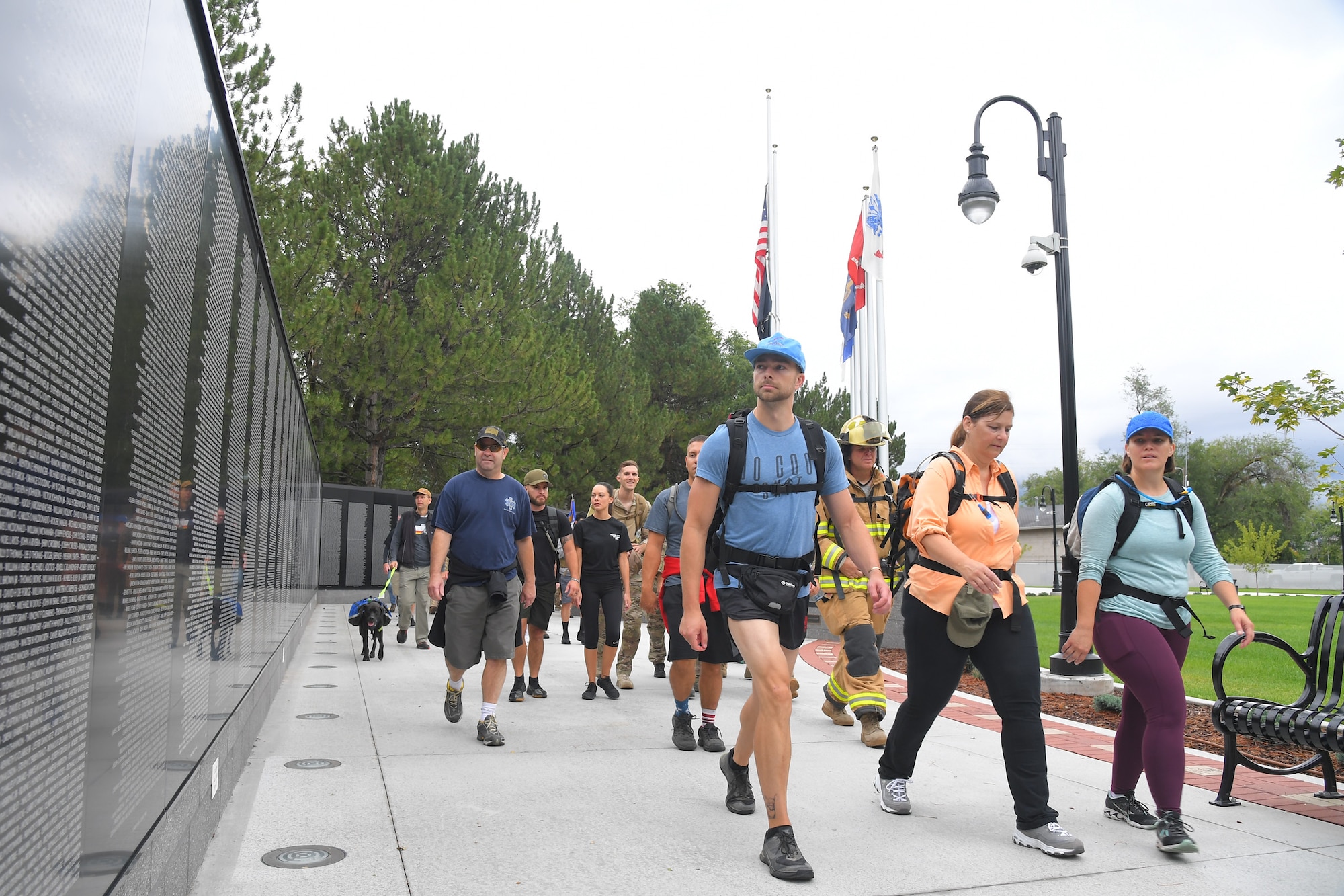 9/11 Memorial Ruck March participants, stride past the Vietnam War Memorial in Layton, Utah, Sept. 11, 2019. The Ruck March event was co-sponsored by Hill Air Force Base first responders and fire and police departments from Kaysville and Layton, to honor and remember the fallen from the events of Sept. 11, 2001. (U.S. Air Force photo by Todd Cromar)