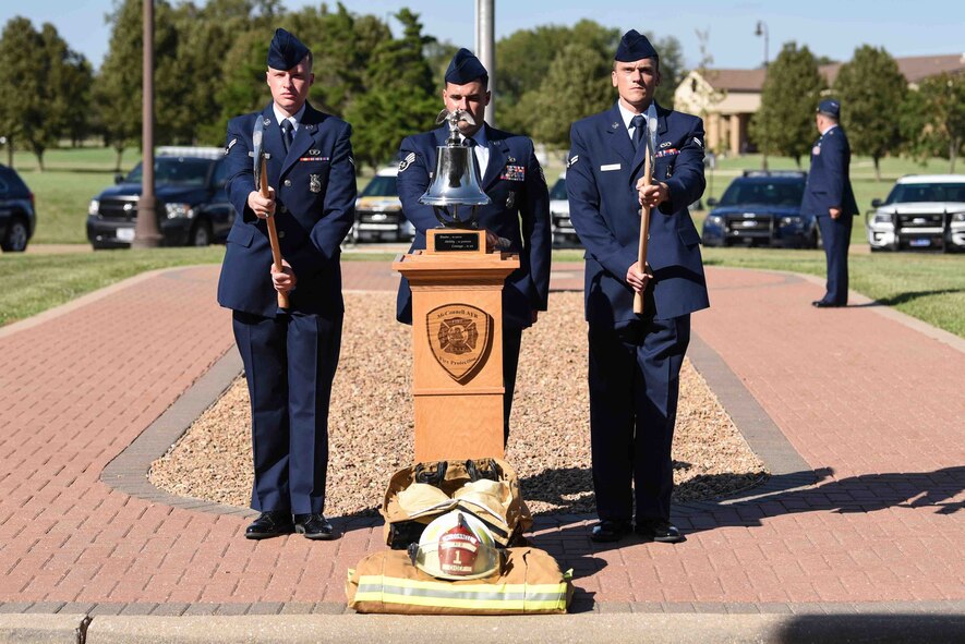 Firemen assigned to the 22nd Civil Engineering Squadron, ring the last alarm during the Patriot Day Ceremony Sept. 11, 2019, at McConnell Air Force Base, Kan. The last alarm honors firefighters that lost their lives on 9/11, it is represented by a bell that is rung three times, signifying the end of their final alarm. (U.S. Air Force photo by Airman 1st Class Alexi Bosarge)