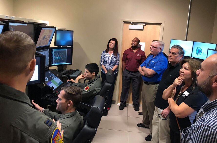 Members of the Military Affairs Committee visited Airmen at Creech Air Force Base, Nevada. August 28, 2019. During their tour, the members visited Airmen around base at the flight simulators, MQ-9 Reaper display and mission brief. (U.S. Air Force photo by Senior Airman Haley Stevens)