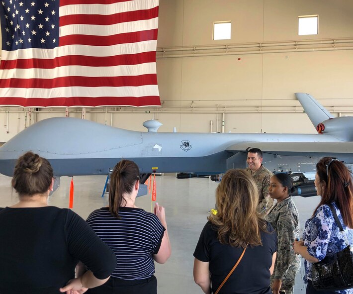 Members of the Military Affairs Committee visited Airmen at Creech Air Force Base, Nevada. August 28, 2019. During their tour, the members visited Airmen around base at the flight simulators, MQ-9 Reaper display and mission brief. (U.S. Air Force photo by Senior Airman Haley Stevens)