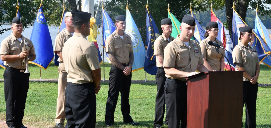 IMAGE: DAHLGREN. Va. (Sept. 11, 2019) – Navy chief select Michael Hanley shares a story of heroism in response to the terrorist attacks and ensuing tragedies on 9/11. Hanley was one of seven chief select ‘heroism readers’ based at commands located on Naval Surface Facility Dahlgren who recounted acts of heroism on that tragic day in our nation’s history.

Hanley – reading to military, first responders, government and contractor personnel gathered to honor the victims of 9/11 – recounted that:
“Welles Crowther was an equities trader on the 104th floor of the South Tower. The man was a volunteer firefighter in his teens, he made his way down to the 78th floor sky lobby and became a hero to the strangers who were trapped there. He helped injured and disoriented office workers to safety, risking his own life. Crowther directed survivors to the stairway and encouraged them to help others while he carried an injured woman on his back. After bringing her 15 floors down to safety, he made his way back up to help others. He never came back...”
