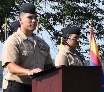 IMAGE: DAHLGREN. Va. (Sept. 11, 2019) – Navy chief select Timothy Klee shares a story of heroism in response to the terrorist attacks and ensuing tragedies on 9/11. Klee was one of seven chief select ‘heroism readers’ based at commands located on Naval Surface Facility Dahlgren who recounted acts of heroism on that tragic day in our nation’s history.

Klee – reading to military, first responders, government and contractor personnel gathered to honor the victims of 9/11 – recounted that:
“Rick Rescorla was responsible for saving more than 2,700 lives, and he sang songs to keep people calm while they evacuated. He was already a hero of the battlefields of Vietnam, where he earned the Silver Star and other awards for his exploits as an Army officer. While working as head of corporate security for Morgan Stanley, he was told after American Flight 11 hit the South tower next to him, to keep his employees at their desks. Rescorla, who had frequently warned the Port Authority and his company about the World Trade Center's security weaknesses, had already issued the order to evacuate. He had made Morgan Stanley employees practice emergency drills for years, and it paid off that day: Just 16 minutes after the first plane hit the opposite tower, more than 2,700 employees and visitors were out when the second plane hit their building. During the evacuation, Rescorla calmly reassured people. Singing ‘God Bless America over a bullhorn as they walked down the stairs.”