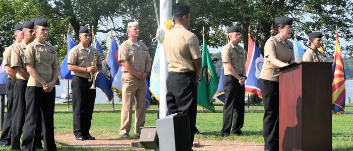 IMAGE: DAHLGREN. Va. (Sept. 11, 2019) – Navy chief select Emily Patch shares a story of heroism in response to the terrorist attacks and ensuing tragedies on 9/11. Patch was one of seven chief select ‘heroism readers’ based at commands located on Naval Surface Facility Dahlgren who recounted acts of heroism on that tragic day in our nation’s history.

Patch – reading to military, first responders, government and contractor personnel gathered to honor the victims of 9/11 – recounted that:
“When the Pentagon was hit by American Airlines Flight 77, Army Spc. Beau Doboszenski was working as a tour guide. After a Navy captain inquired if anyone had medical training, Doboszenski sprung into action. He was a former firefighter and had been trained as an EMT. He ran into the building, past barricades and police. Doboszenski gave first aid to victims and afterward, was part of a team that went back in to look for any survivors despite the building still being in flames.”