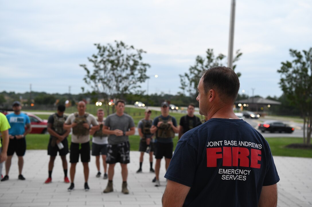 U.S. Air Force Lt. Col. Daniel C. Werner, 11th Civil Engineer Squadron commander, leads opening remarks at the stair climb event on Joint Base Andrews, Md., Sept. 9, 2019. Participants climbed up and down stairs on base to commemorate the number of stairs first responders had to climb in the World Trade Center towers during the 9/11 attacks in 2001. (U.S. Air Force photo by Airman 1st Class Spencer J. Slocum)