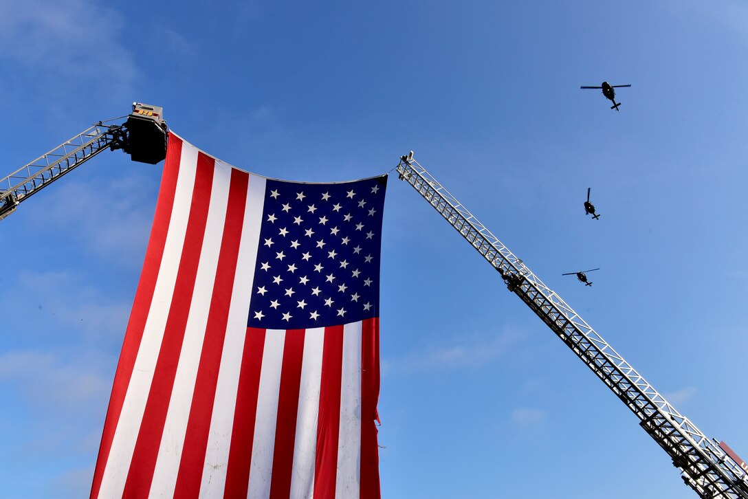 The 1st Helicopter Squadron at Joint Base Andrews flies over the 9/11 memorial ceremony on JBA Sept. 11, 2019. Nearly 3,000 people lost their lives in the terrorist attack on Sept. 11, 2001. (U.S. Air Force photo by Airman 1st Class Noah Sudolcan)