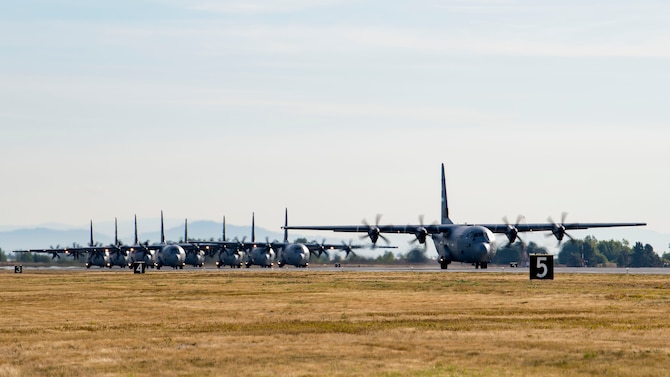 Mulitple U.S. Air Force, Joint and Coalition C-130Js and KC-130Js prepare to take off during exercise Mobility Guardian 2019 at Fairchild Air Force Base, Washington, Sept. 12, 2019. More than 4,000 personnel participated in or observed exercise Mobility Guardian, including Total Force Airmen, Joint, Combat Air Forces, and International Partners. (U.S. Air Force photo by Airman 1st Class Lawrence Sena)
