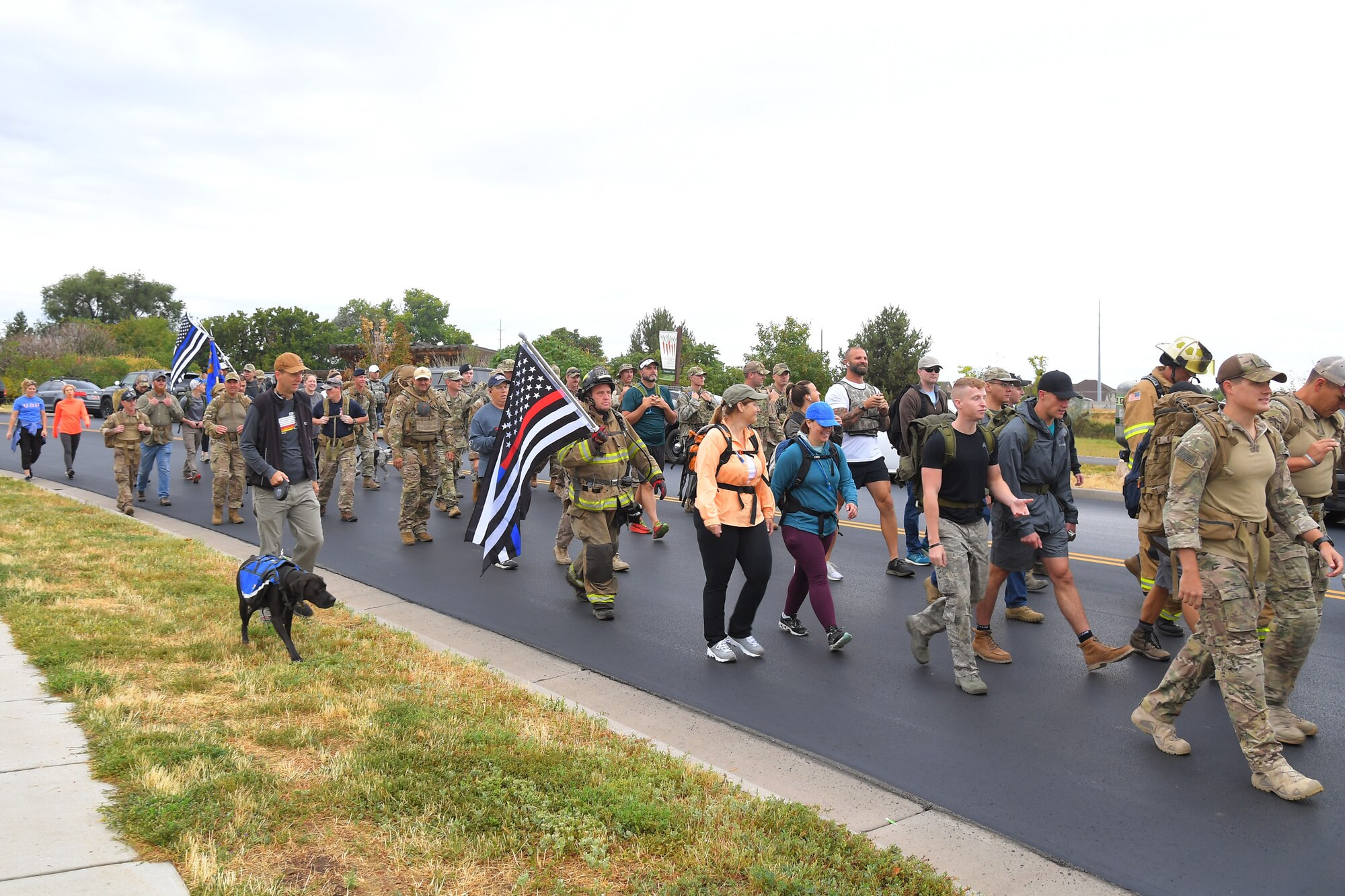 Participants begin their walk of 9.11 miles, some with 30-pound packs or firefighter gear, during 9/11 Memorial Ruck March, in Kaysville, Utah, Sept. 11, 2019. The event was co-sponsored by Hill Air Force Base first responders and fire and police departments from Kaysville and Layton, to honor and remember the fallen from the events of Sept. 11, 2001. (U.S. Air Force photo by Todd Cromar)