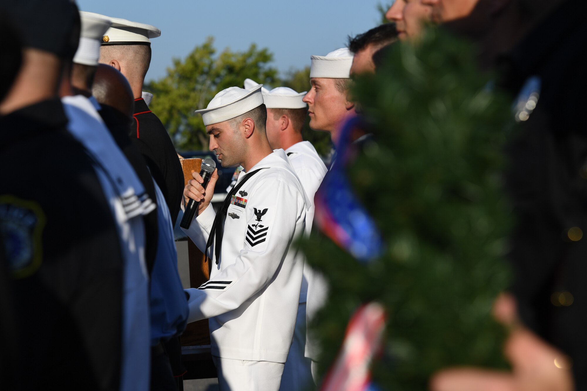 U.S. Navy Aerographers Mate 1st Class Richard Martinez, Center for Naval Aviation Technical Training Unit Keesler instructor, delivers remarks during a 9/11 memorial ceremony hosted by CNATTU Keesler in front of the 81st Training Wing headquarters building on Keesler Air Force Base, Mississippi, Sept. 11, 2019. The event honored those who lost their lives during the 9/11 attacks. (U.S. Air Force photo by Kemberly Groue)