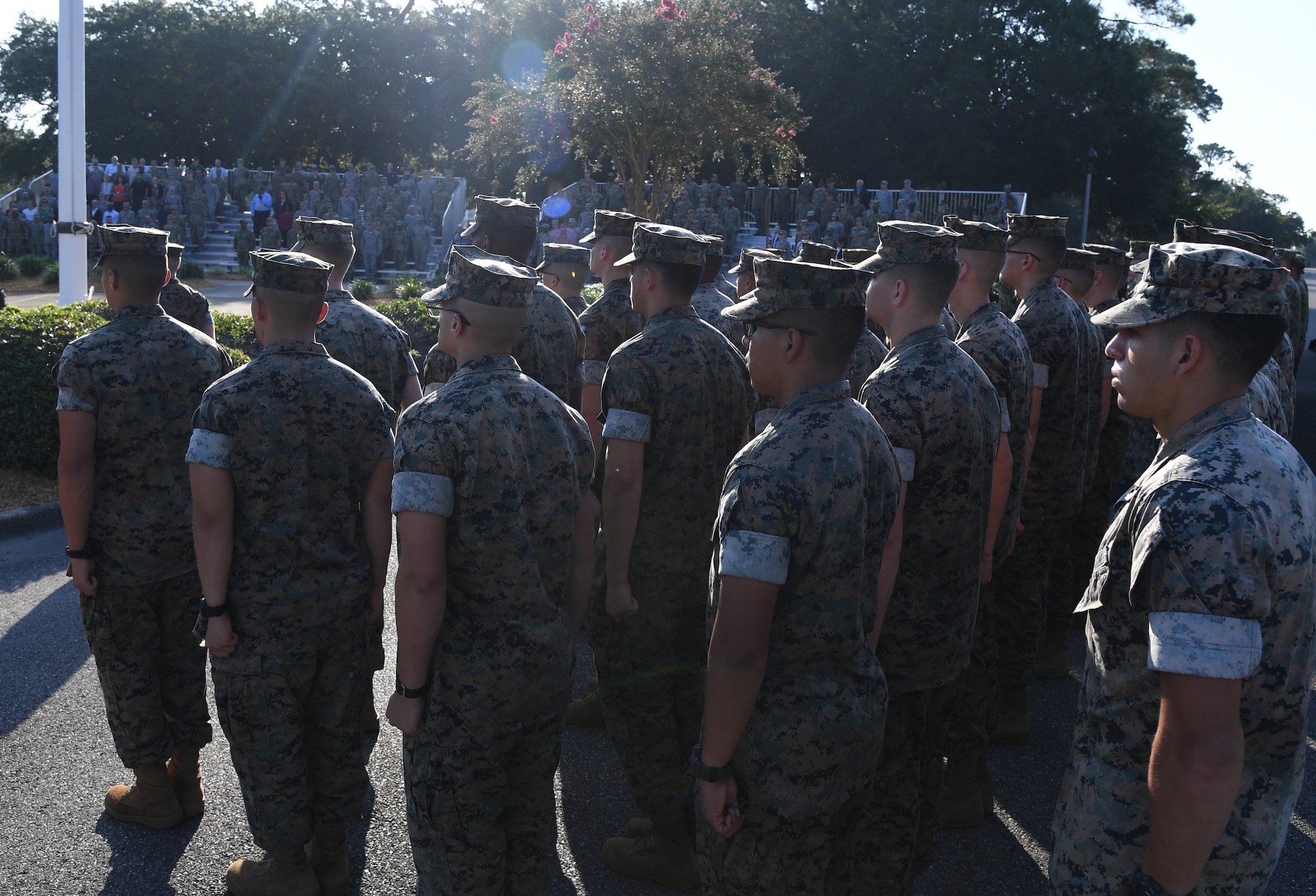 Members of the Keesler Marine Detachment stand in formation during a 9/11 memorial ceremony hosted by the Center for Naval Aviation Technical Training Unit Keesler in front of the 81st Training Wing headquarters building on Keesler Air Force Base, Mississippi, Sept. 11, 2019. The event honored those who lost their lives during the 9/11 attacks. (U.S. Air Force photo by Kemberly Groue)