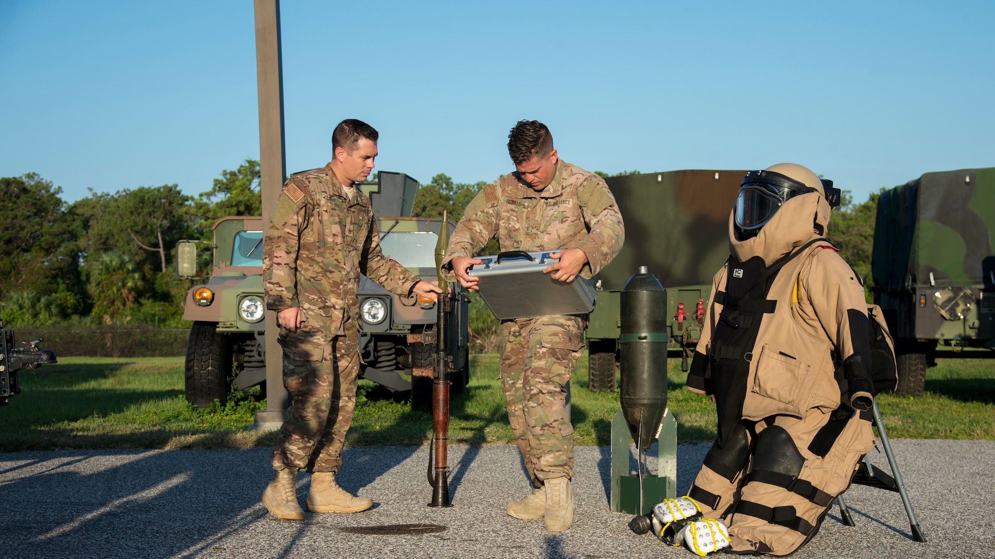 U.S. Air Force Master Sgt. Ryan Oliver, the 6th Civil Engineer Squadron Explosive Ordnance Disposal Flight section chief, and Staff Sgt. Jordan Oswald, a 6th CES/ EOD technician, set up a visual aid display, Sept. 11, 2019, at MacDill Air Force Base, Fla.  The 6th EOD Flight hosted an annual explosives training for local Transportation Security Administration officers at MacDill. (U.S. Air Force photo by Airman 1st Class Shannon Bowman)