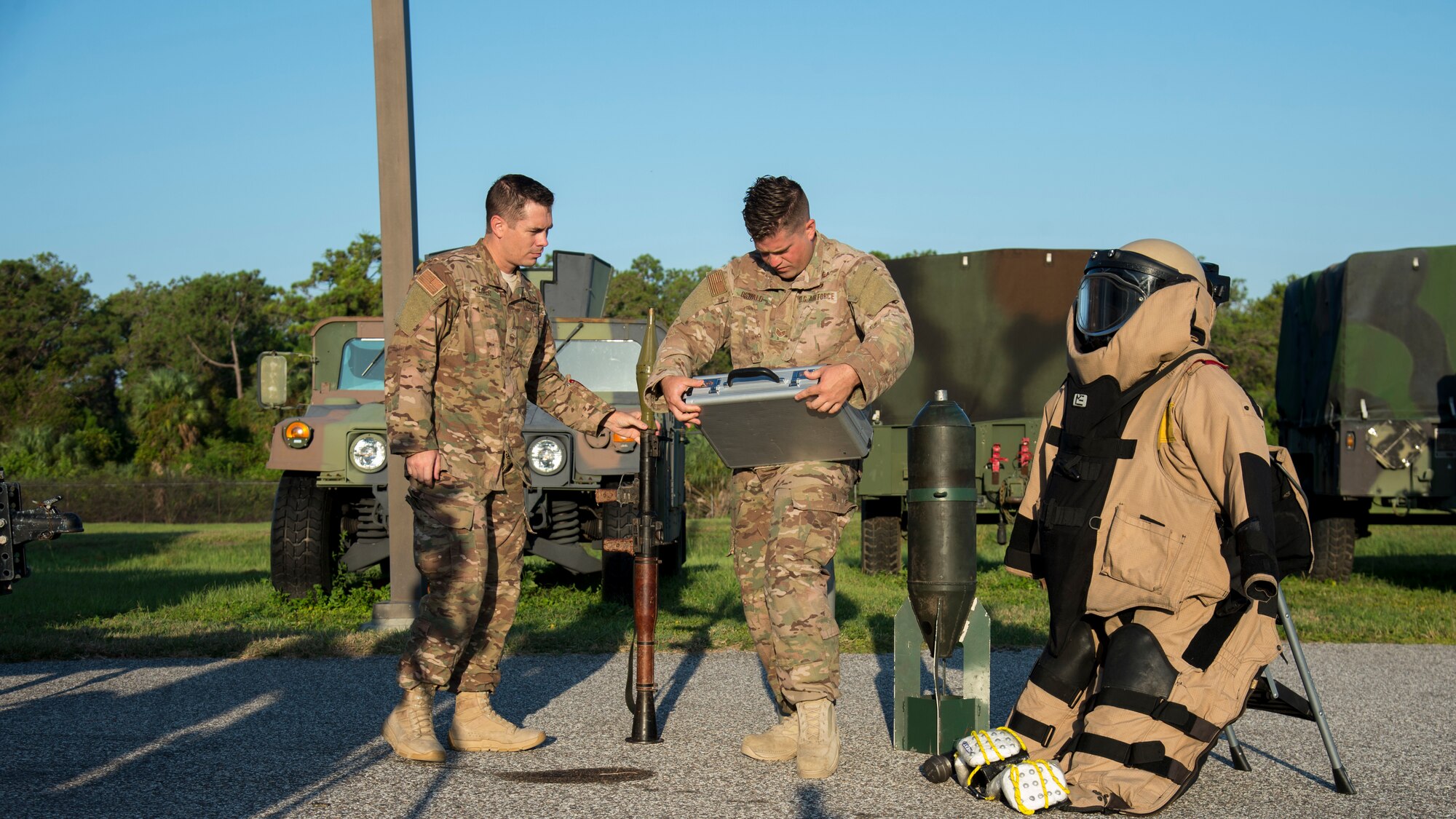 U.S. Air Force Master Sgt. Ryan Oliver, the 6th Civil Engineer Squadron Explosive Ordnance Disposal Flight section chief, and Staff Sgt. Jordan Oswald, a 6th CES/ EOD technician, set up a visual aid display, Sept. 11, 2019, at MacDill Air Force Base, Fla.  The 6th EOD Flight hosted an annual explosives training for local Transportation Security Administration officers at MacDill. (U.S. Air Force photo by Airman 1st Class Shannon Bowman)
