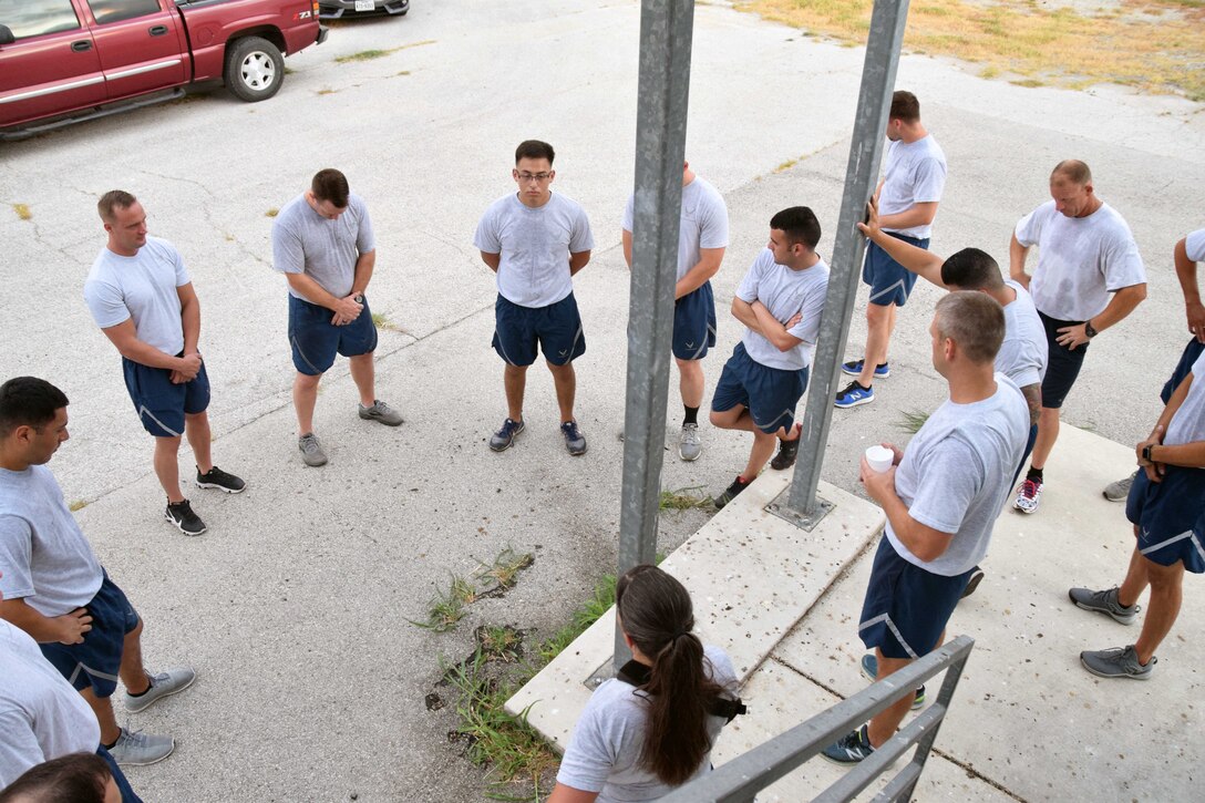 The 433rd Civil Engineer Squadron firefighters pause for a moment of silence at the halfway point of their 9/11 Memorial Stair Climb to remember the firefighters lost during the Sept. 11 attacks on the World Trade Center Sept. 8, 2019 at Joint Base San Antonio-Lackland, TX.