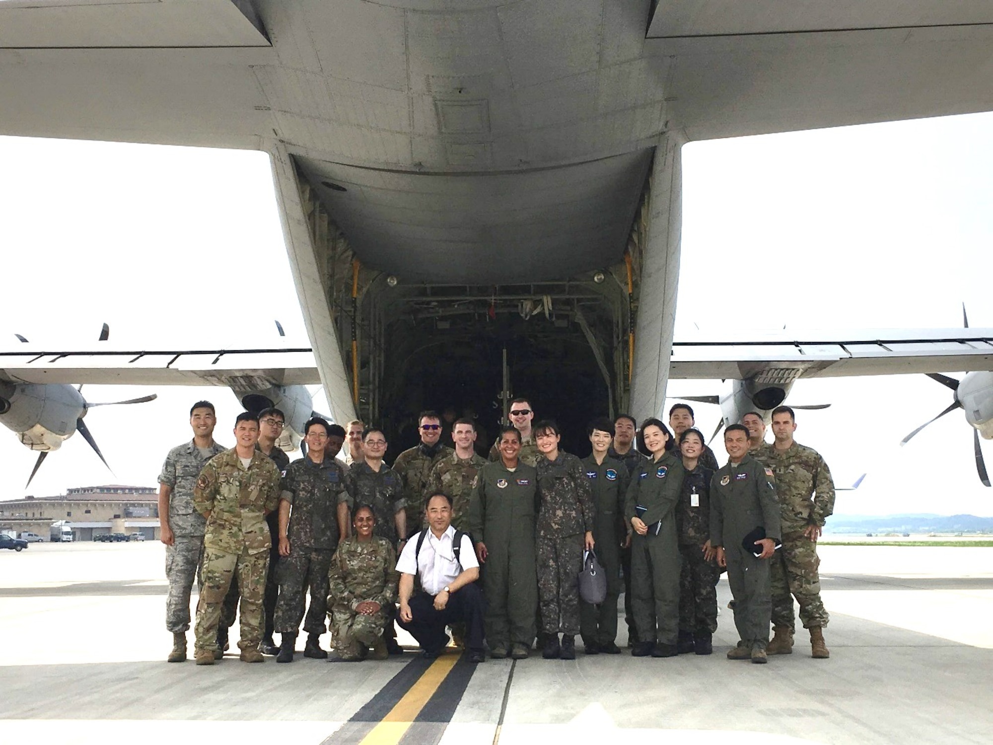 U.S. Air Force, Republic of Korea Air Force and civilian participants pose for a group photo during the inaugural Joint Combined ROK-U.S. Aeromedical Evacuation Subject Matter Expert Exchange at Osan Air Base, South Korea, Aug. 28, 2019. The goal of this SMEE was to build trust and enhance interoperability to support the mission of ROK-U.S. Combined Force Command by understanding and synchronizing both parties' aeromedical evacuation capabilities. (Courtesy)