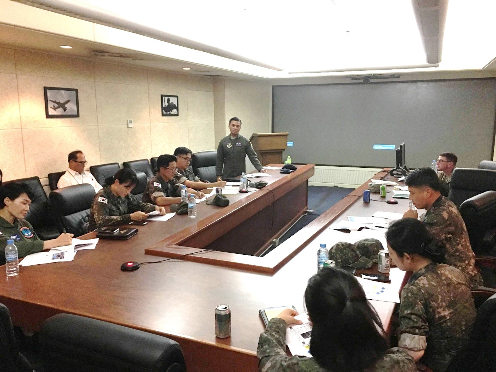 U.S. Air Force Capt. Randolph Matias, 18th Aeromedical Evacuation Squadron flight nurse from Kadena Air Base, Japan, briefs the patient movement during an Aeromedical Evacuation Subject Matter Expert Exchange at Osan Air Base, 28 Aug 2019. The goal of this SMEE was to build trust and enhance interoperability to support the mission of ROK-U.S. Combined Force Command by understanding and synchronizing both parties' aeromedical evacuation capabilities. (Courtesy)
