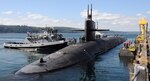 Tugs guide the Ohio-class ballistic missile submarine USS Louisiana (SSBN 743) to its berth at Naval Base Kitsap-Bangor after the completion of a patrol in 2012.