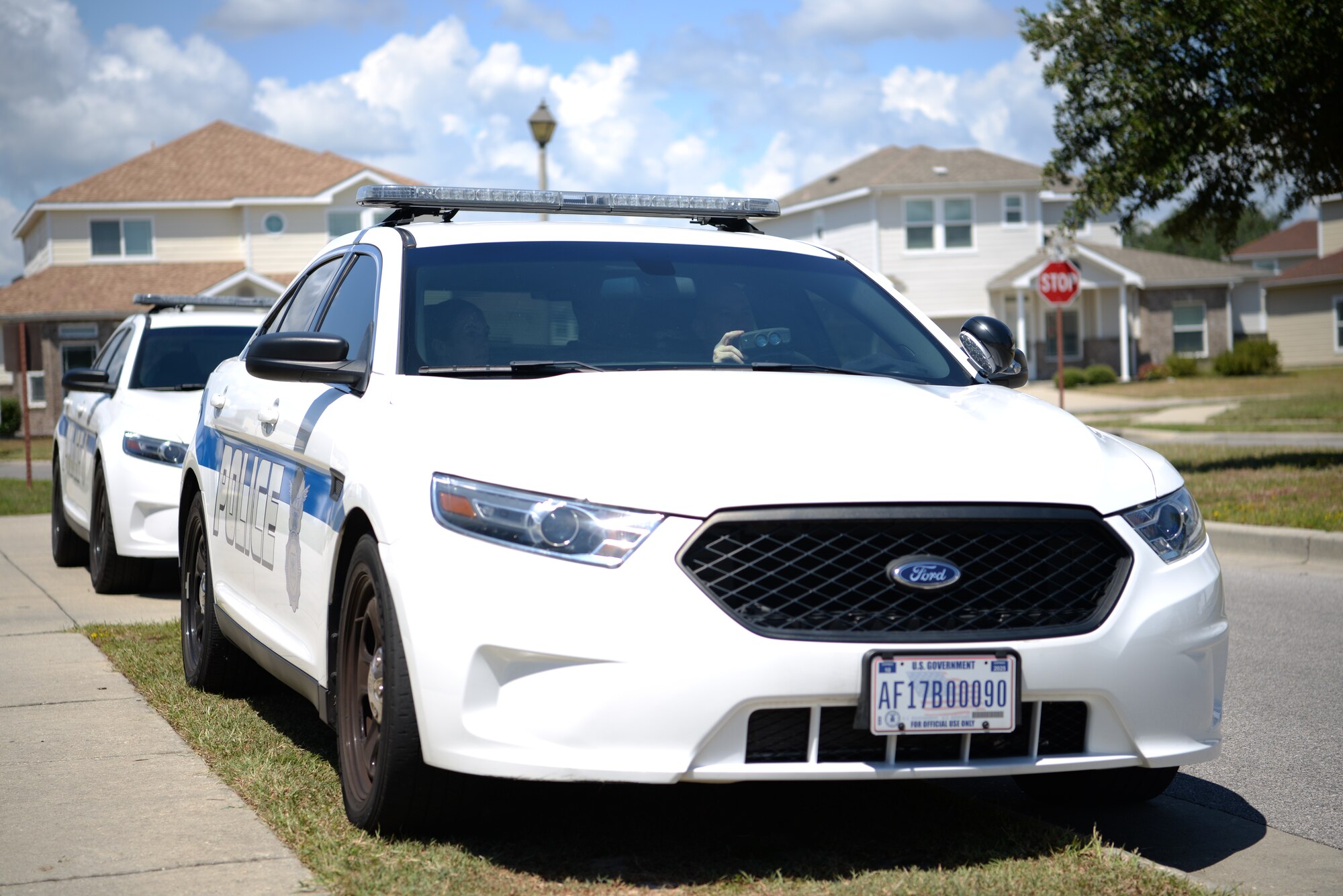 Leadership from the 81st Training Wing and the 81st Security Forces Squadron wait to pull over speeding cars in the Bayridge base housing area on Keesler Air Force Base, Mississippi, September 10, 2019. Security forces has recently started making efforts to crackdown on base speeding amidst concerns brought up during the Keesler Housing Forum. (U.S Air Force photo by Airman 1st Class Spencer Tobler)