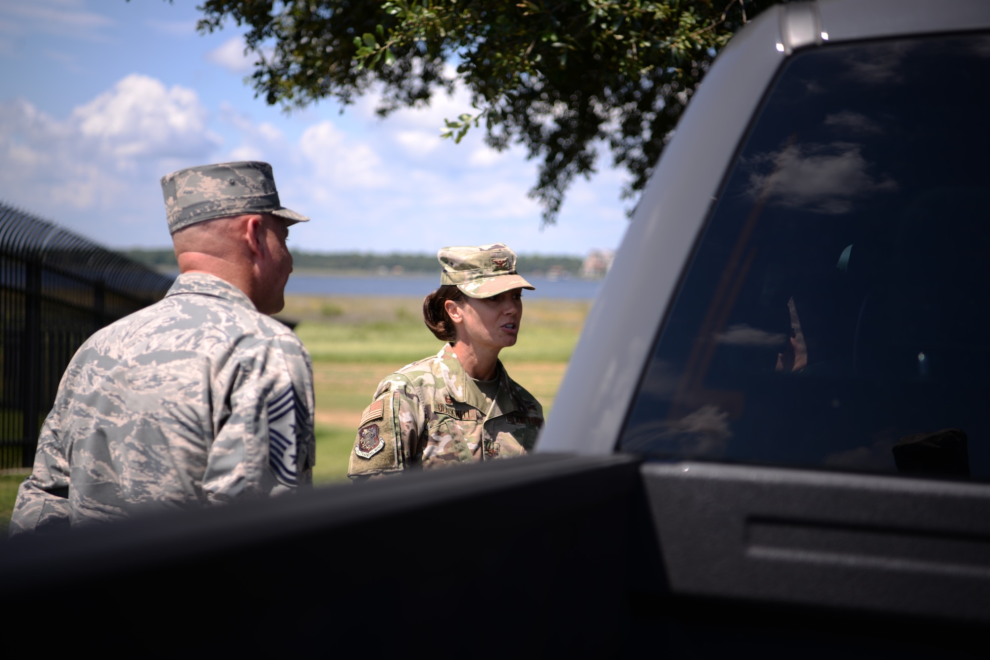 U.S Air Force Col. Heather Blackwell, 81st Training Wing commander, and Chief Master Sgt. David Pizzuto, 81st TRW command chief, address an individual pulled over for speeding in base housing on Keesler Air Force Base, Mississippi, September 10, 2019. The 81st Security Forces Squadron has recently started making efforts to crackdown on base speeding amidst concerns brought up during the Keesler Housing Forum. (U.S Air Force photo by Airman 1st Class Spencer Tobler)
