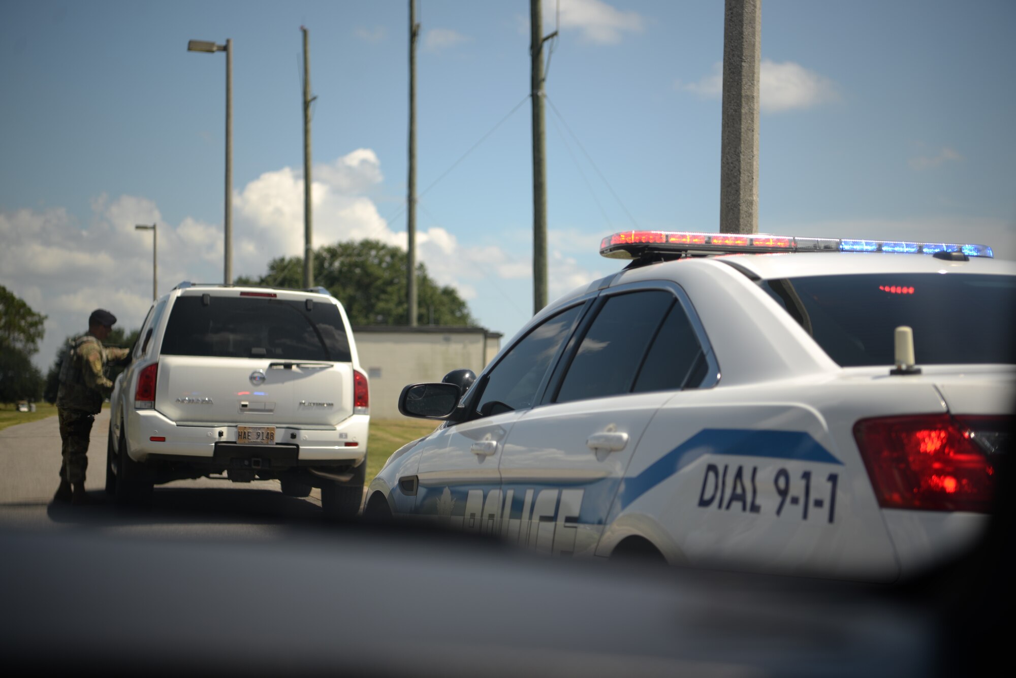 U.S Air Force Maj. Matthew Lowe, 81st Security Forces Squadron commander, addresses an individual pulled over for speeding in base housing on Keesler Air Force Base, Mississippi, September 10, 2019. The 81st SFS has recently started making efforts to crackdown on base speeding amidst concerns brought up during the Keesler Housing Forum. (U.S Air Force photo by Airman 1st Class Spencer Tobler)