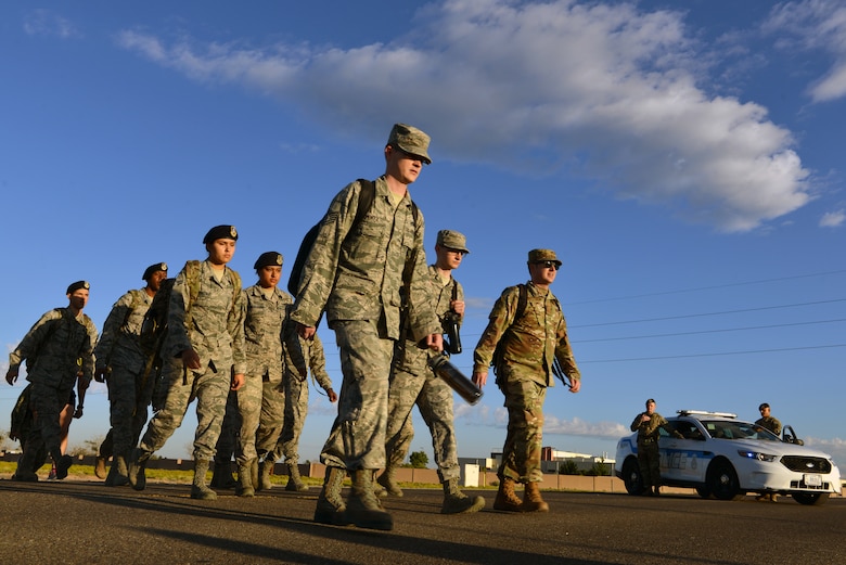 Members of Team Kirtland participate in a 9/11 memorial ruck march at Kirtland Air Force Base, N.M., Sept. 11, 2019. More than 50 members participated in the four-mile ruck march held to honor and remember the nearly 3,000 people that died in the attacks on 9/11 and for those that have been killed in defense of the country since that day. (U.S. Air Force photo by Staff Sgt. Dylan Nuckolls/Released)