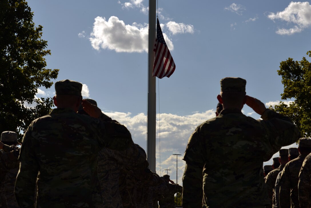 Airmen salute during a 9/11 retreat ceremony at Kirtland Air Force Base, N.M., Sept. 11, 2019. The retreat ceremony was held to honor and remember the nearly 3,000 people that died in the attacks on 9/11 and for those that have been killed in defense of the country since that day. (U.S. Air Force photo by Staff Sgt. Dylan Nuckolls/Released)