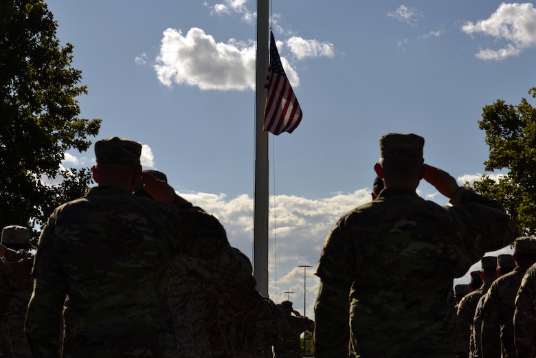 Airmen salute during a 9/11 retreat ceremony at Kirtland Air Force Base, N.M., Sept. 11, 2019. The retreat ceremony was held to honor and remember the nearly 3,000 people that died in the attacks on 9/11 and for those that have been killed in defense of the country since that day. (U.S. Air Force photo by Staff Sgt. Dylan Nuckolls/Released)
