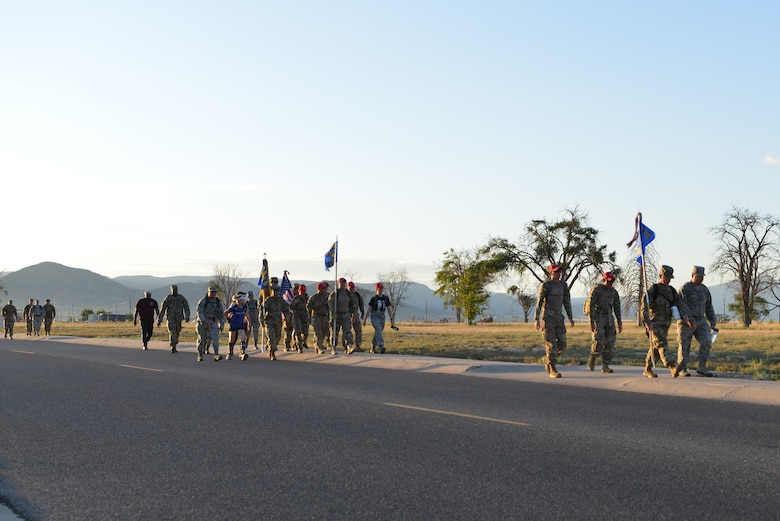 Members of Team Kirtland participate in a 9/11 memorial ruck march at Kirtland Air Force Base, N.M., Sept. 11, 2019. More than 50 members participated in the four-mile ruck march held to honor and remember the nearly 3,000 people that died in the attacks on 9/11 and for those that have been killed in defense of the country since that day. (U.S. Air Force photo by Staff Sgt. Dylan Nuckolls/Released)