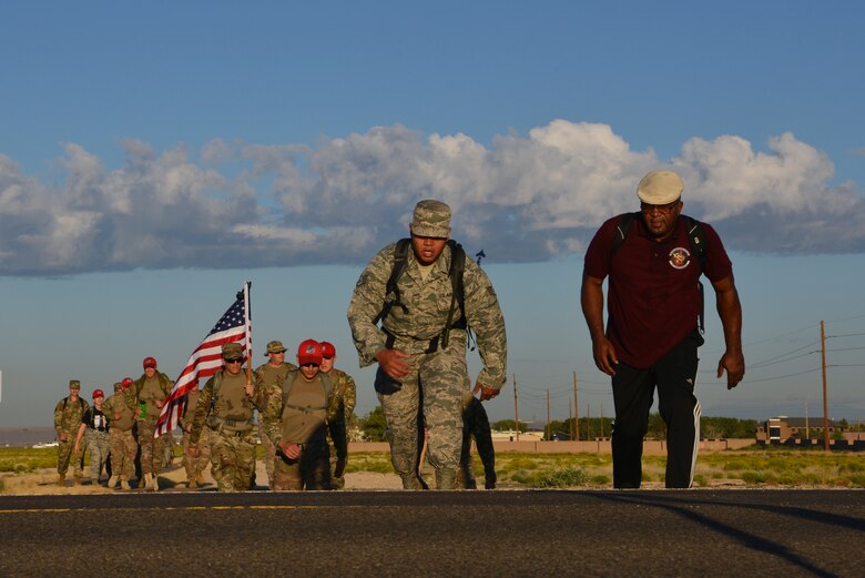 Members of Team Kirtland participate in a 9/11 memorial ruck march at Kirtland Air Force Base, N.M., Sept. 11, 2019. More than 50 members participated in the four-mile ruck march held to honor and remember the nearly 3,000 people that died in the attacks on 9/11 and for those that have been killed in defense of the country since that day. (U.S. Air Force photo by Staff Sgt. Dylan Nuckolls/Released)