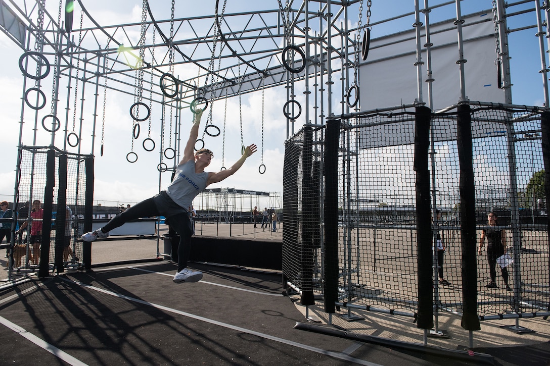 2nd Lt. Michelle Strickland takes to the rings during the 2019 Air Force Alpha Warrior Final Battle at Retama Park, Selma, Texas, Sept. 12, 2019. Air Force, Army and Navy military athletes competed against each other to determine the top three men and three women for each service. Those athletes make up the service teams that will go against each other during the 2019 Inter-Service Battle Sept. 14 at Retama. The Air Force partnered with Alpha Warrior three years ago to deliver functional fitness training to Airmen and their families. (U.S. Air Force photo by Sarayuth Pinthong)