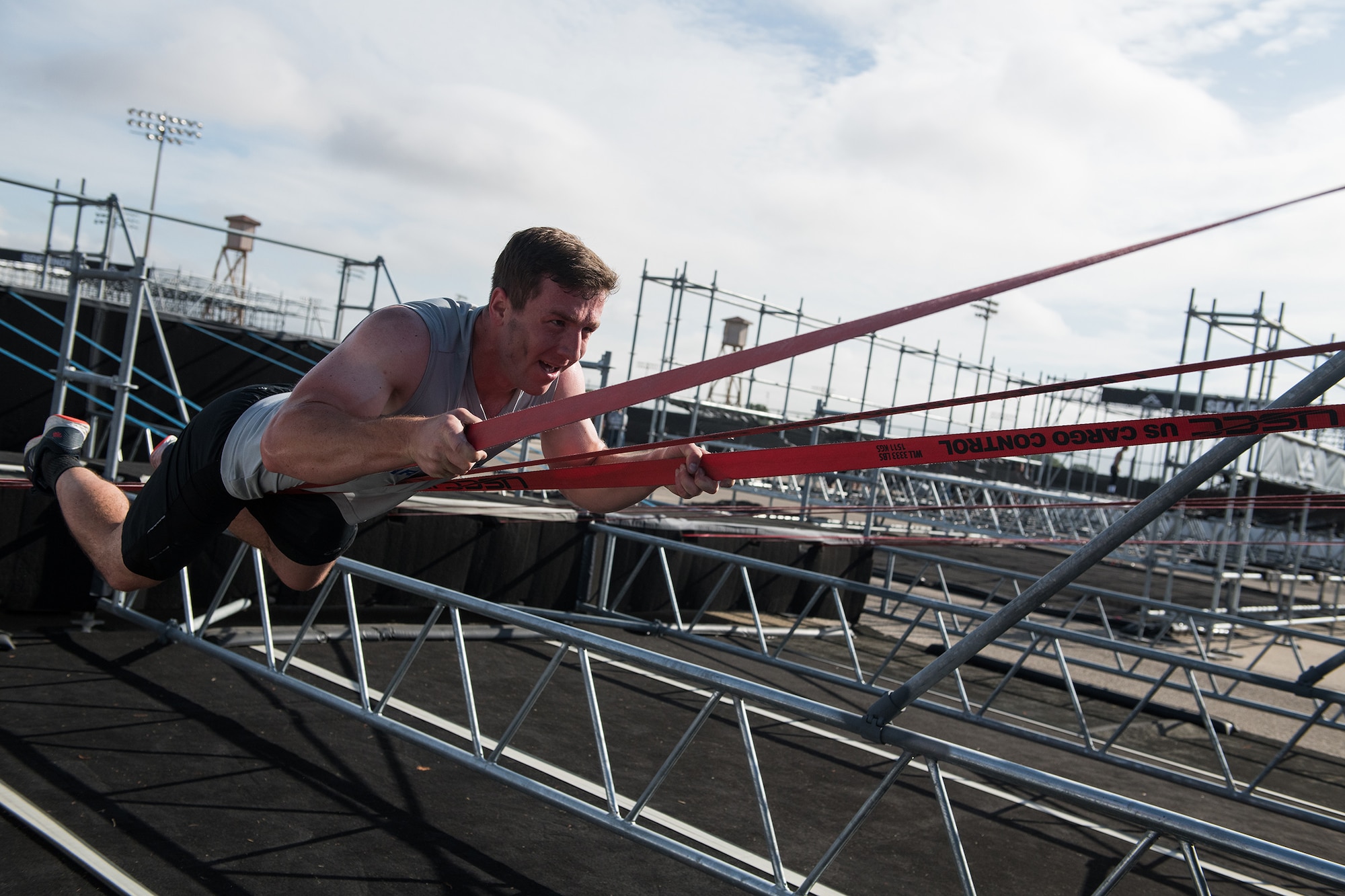 2nd Lt. Jesse Montgomery takes on an obstacle during the 2019 Air Force Alpha Warrior Final Battle at Retama Park, Selma, Texas, Sept. 12, 2019. Air Force, Army and Navy military athletes competed against each other to determine the top three men and three women for each service. Those athletes make up the service teams that will go against each other during the 2019 Inter-Service Battle Sept. 14 at Retama. The Air Force partnered with Alpha Warrior three years ago to deliver functional fitness training to Airmen and their families. (U.S. Air Force photo by Sarayuth Pinthong)